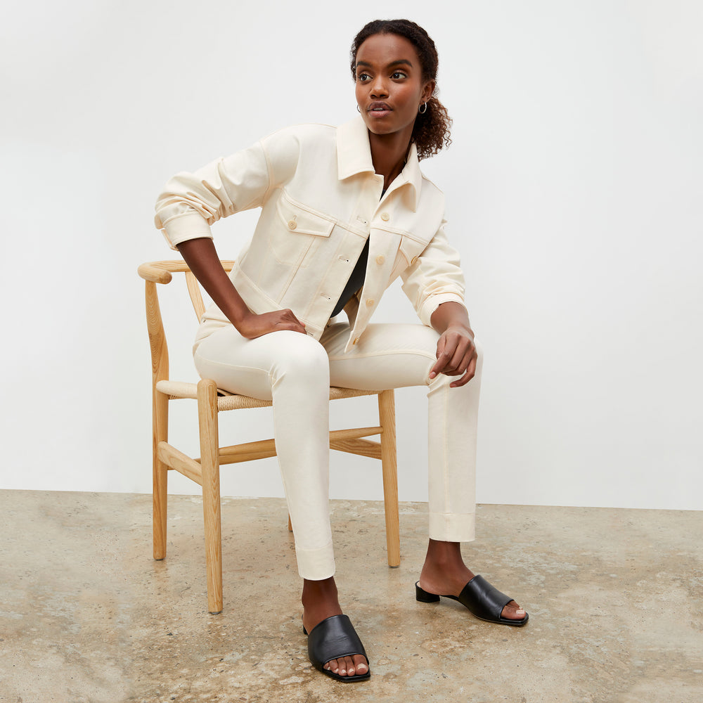 Side image of a woman wearing the Sammataro Jean in Tusk