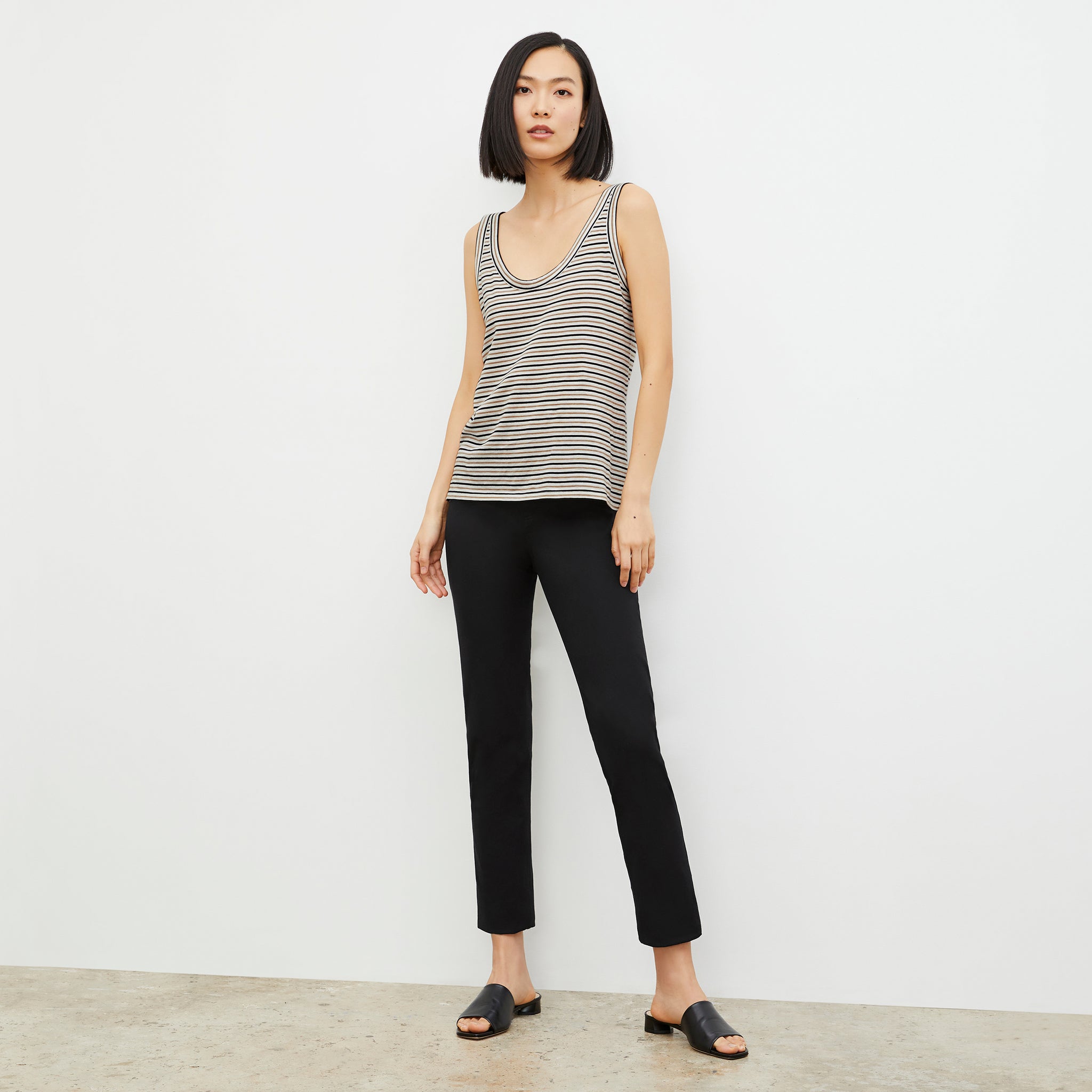 Front image of a woman wearing the Wyatt Tank - Thin Striped Pima Cotton in Tan / Black 
