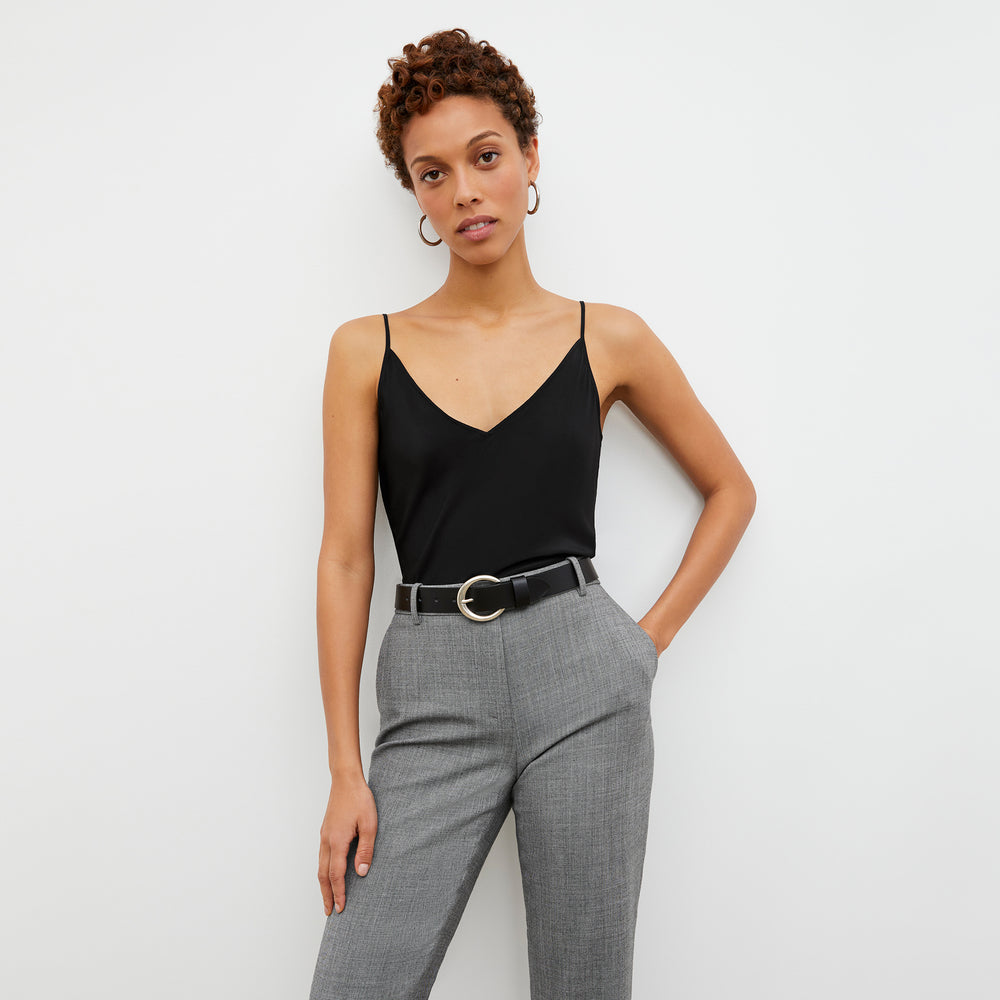 Front image of a woman wearing the Circle Buckle Belt in Black
