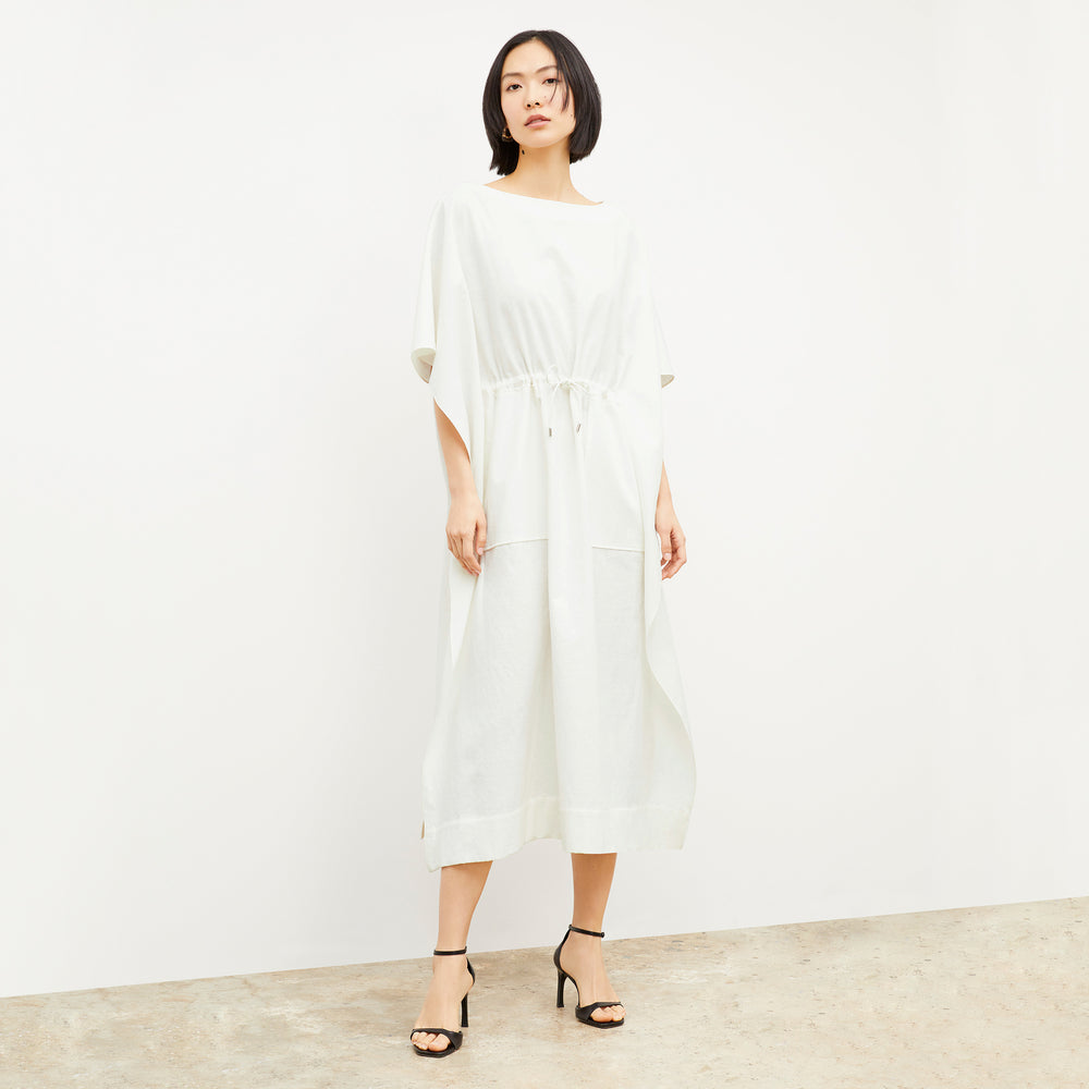 Front image of a woman wearing the Freedlund Caftan in Ivory