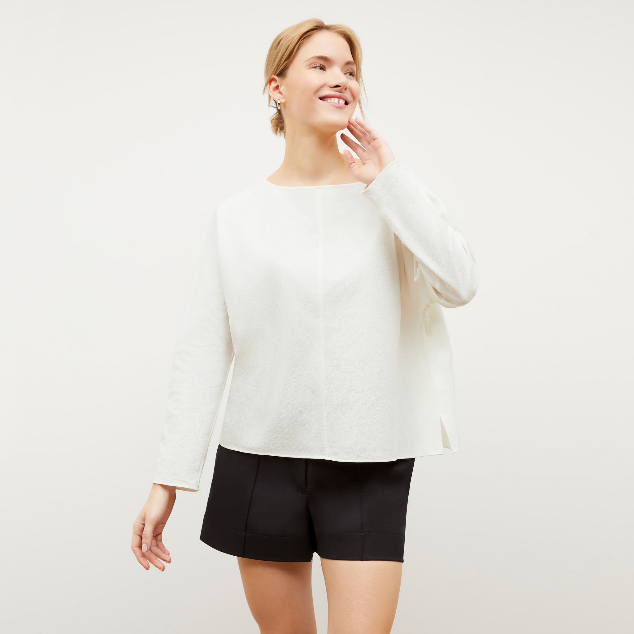 Image of a woman wearing the Wren top in Ivory 