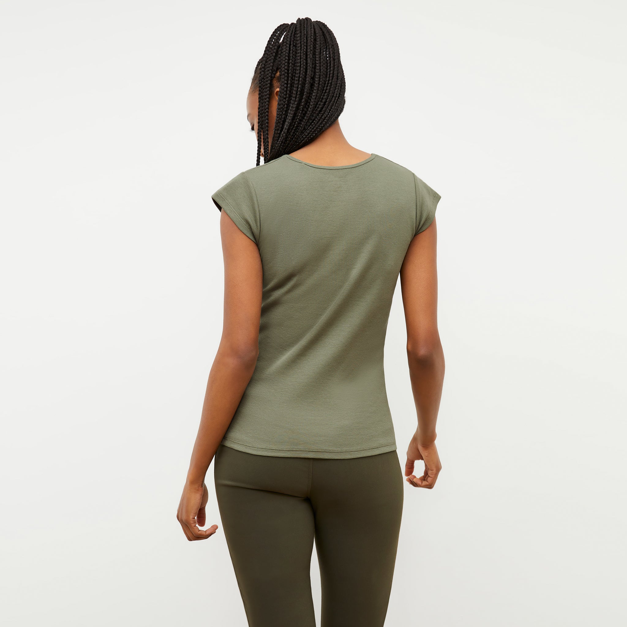 Back image of a woman wearing the Mori Henley T-shirt in Dark Sage