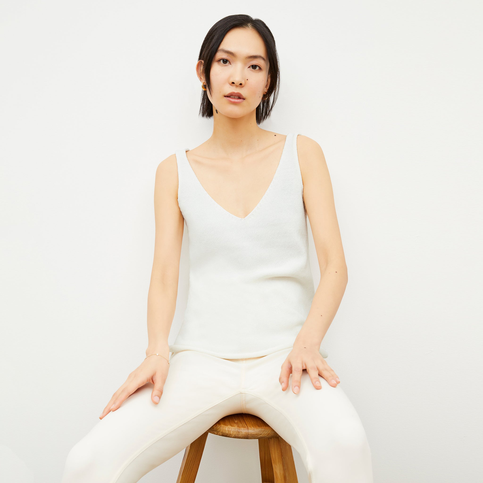 Image of a woman wearing the Melody Tank in Ivory 