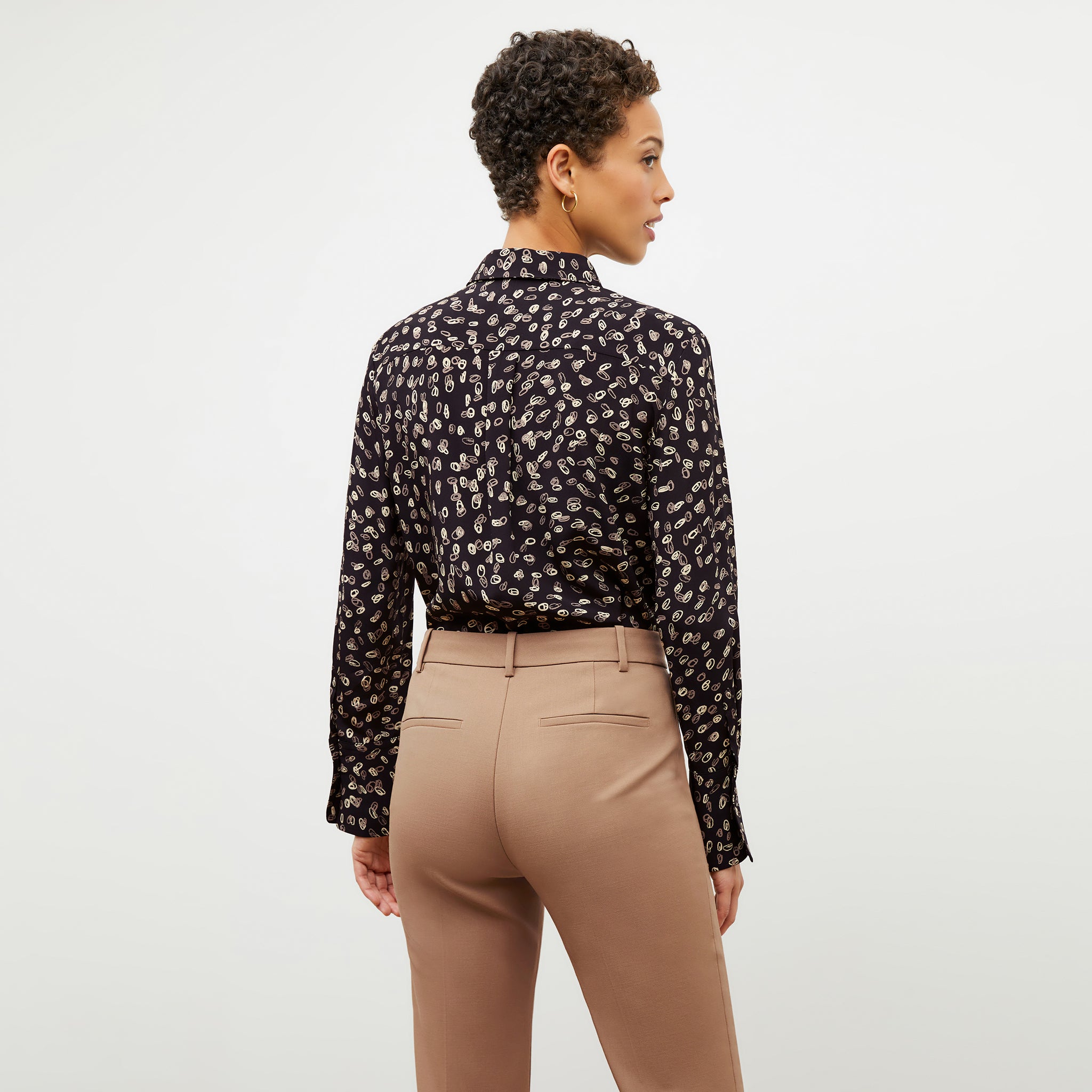 Back image of a woman wearing the Tatum Top in Spin Dot