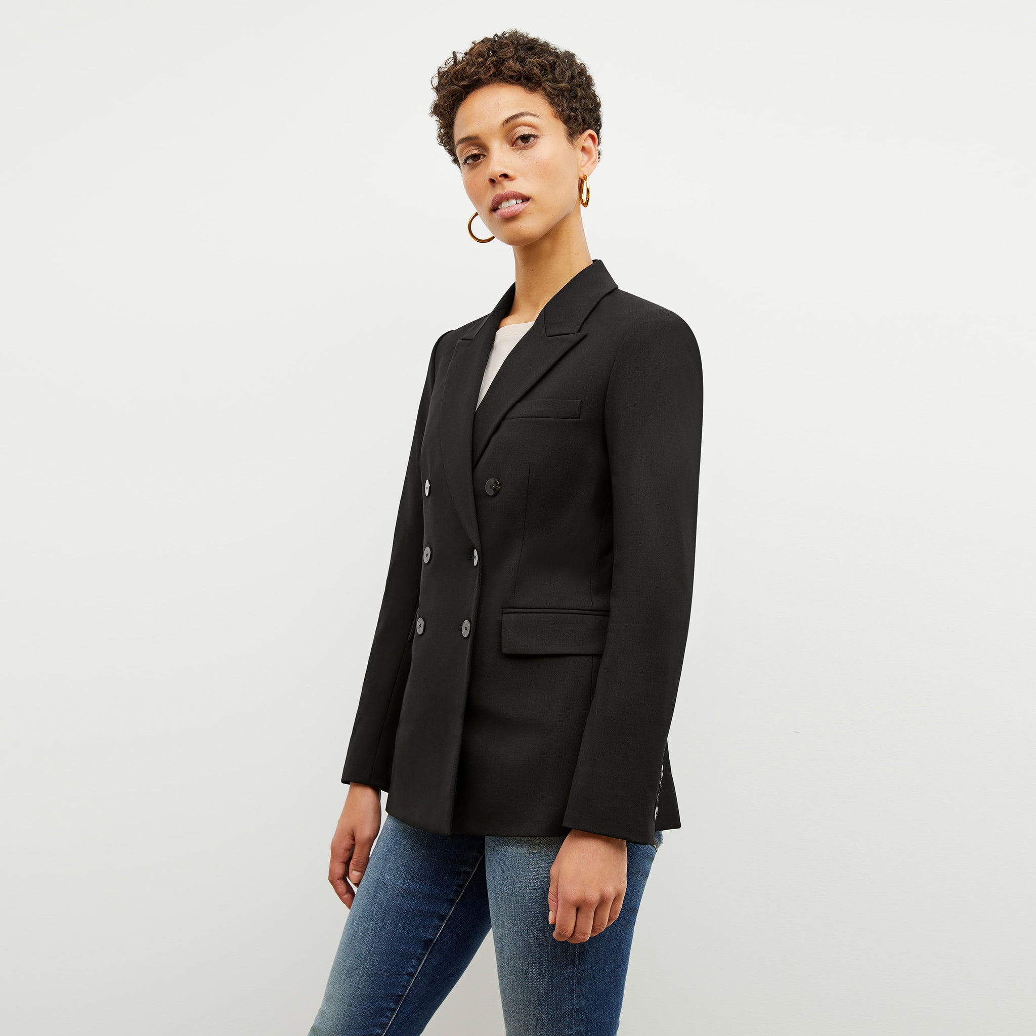Front image of a woman wearing the kati jacket in black