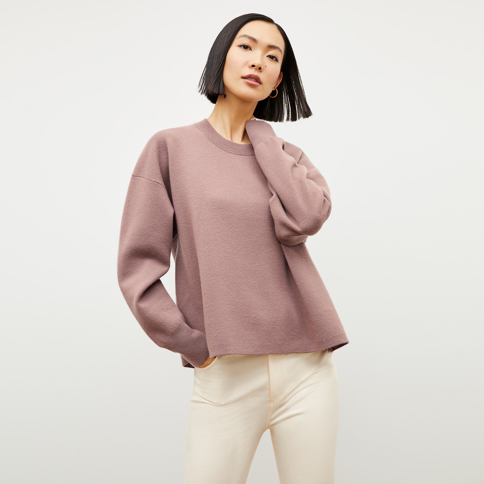 Front image of a woman wearing the quincy sweater in rose taupe  