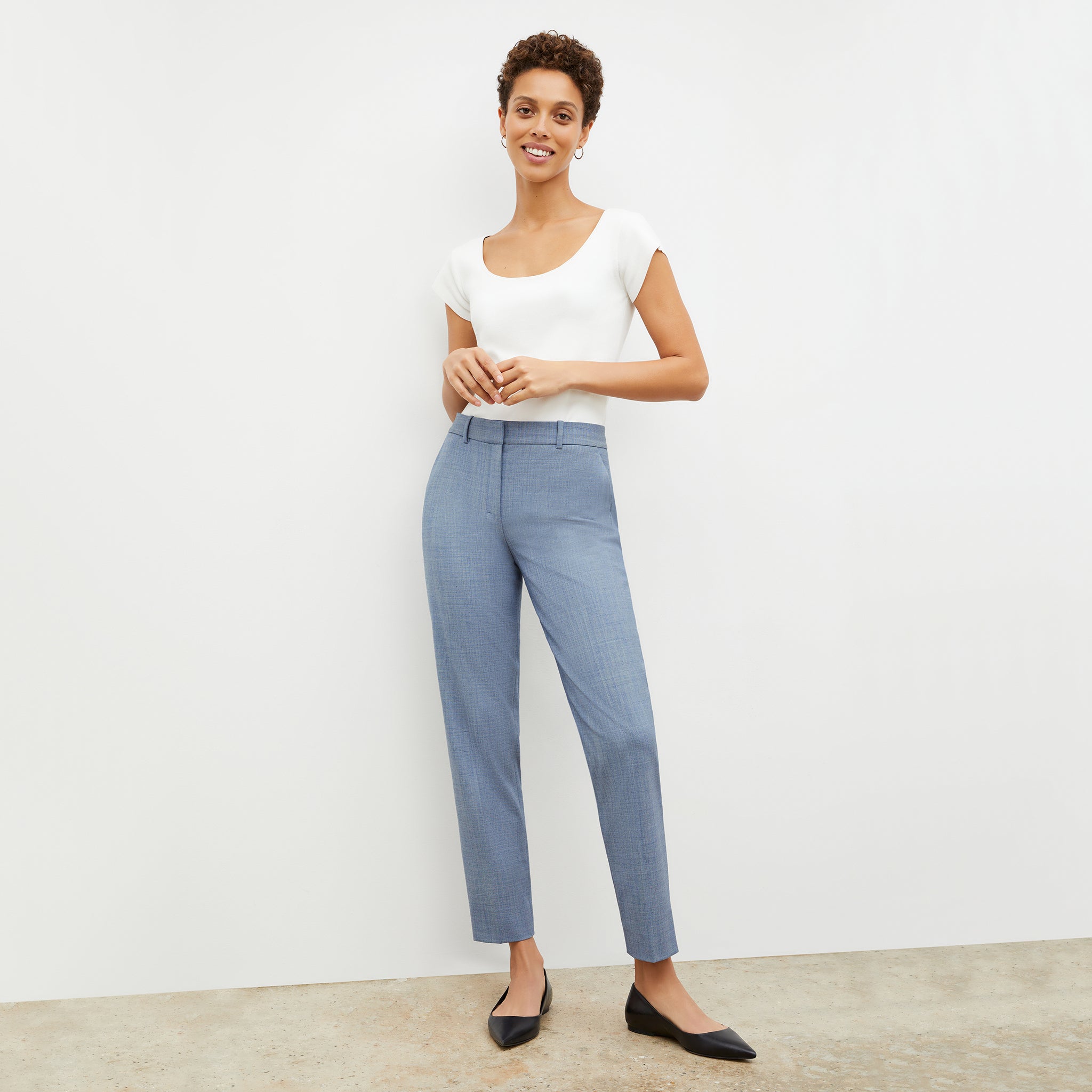 Front image of a woman wearing the mejia pant in indigo and white 
