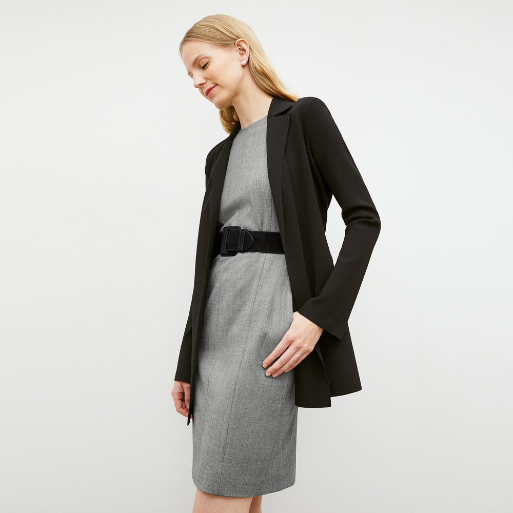 Front image of a woman wearing the constance dress in black and white