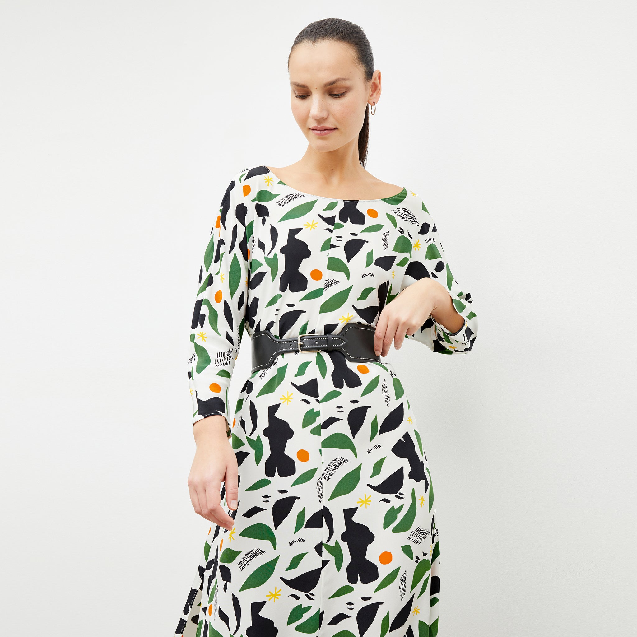 Front image of a woman wearing the alesia dress in icon print