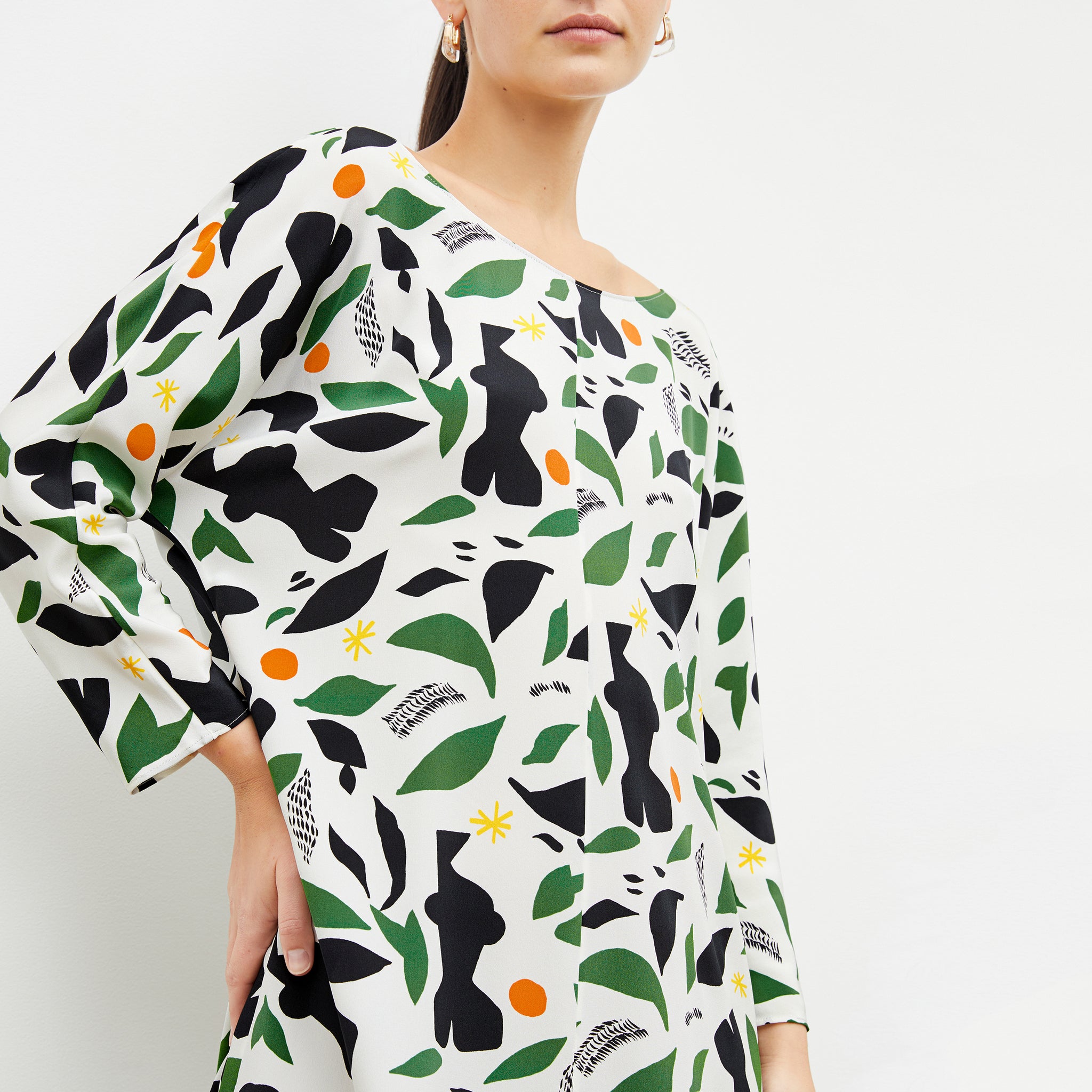 Front image of woman wearing the alesia dress in icon print