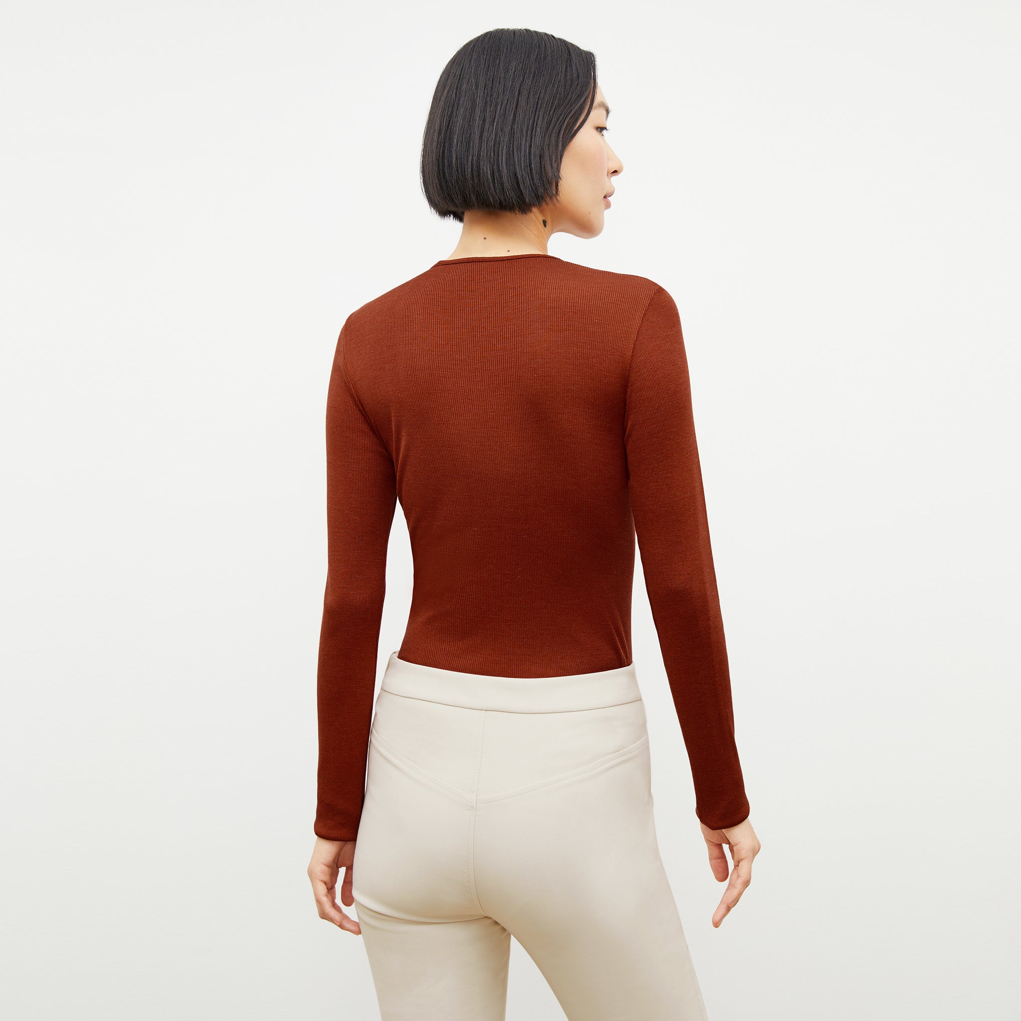 Back image of a woman wearing the malley top in Mars 
