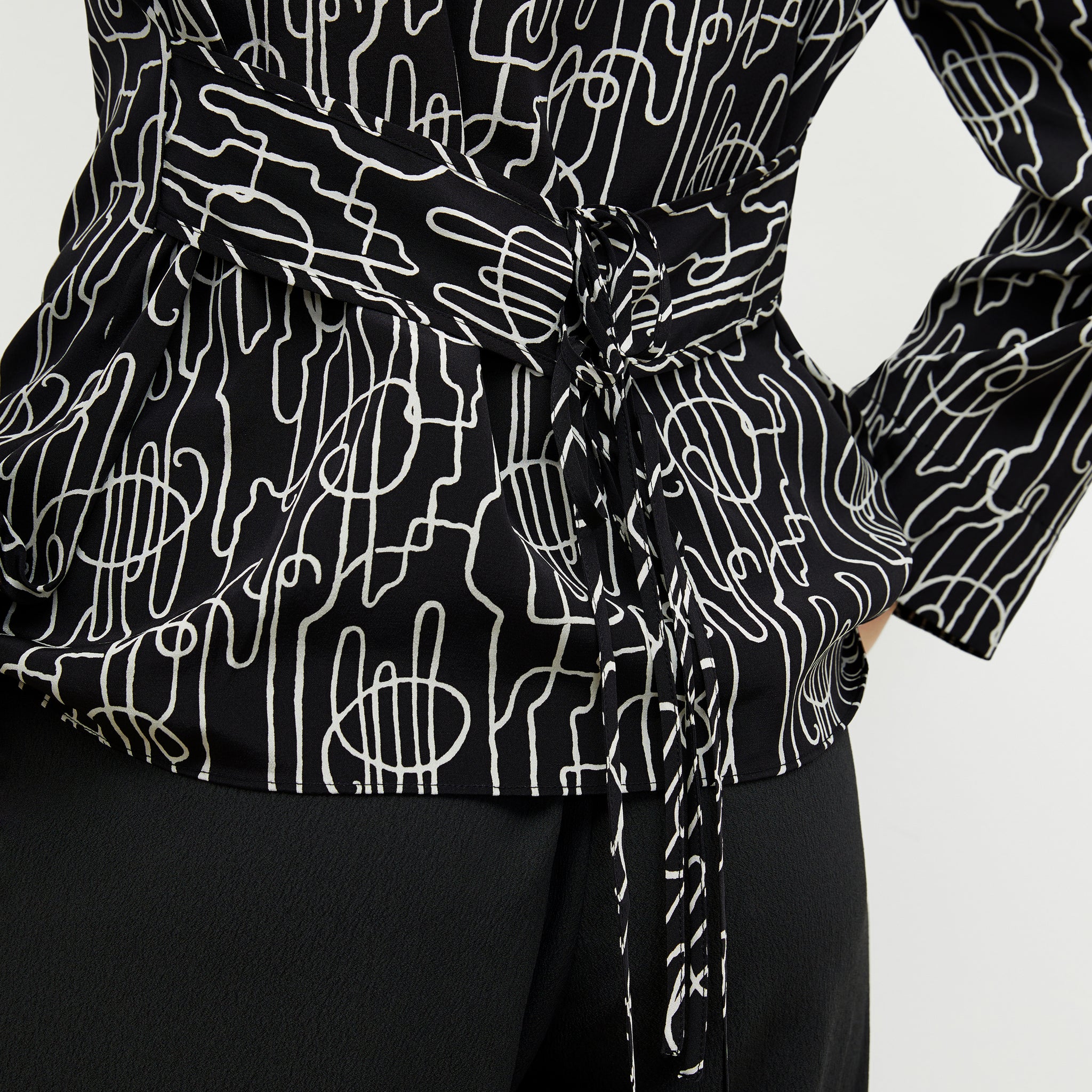 detail image of a woman wearing the alyssa jacket in symphony print