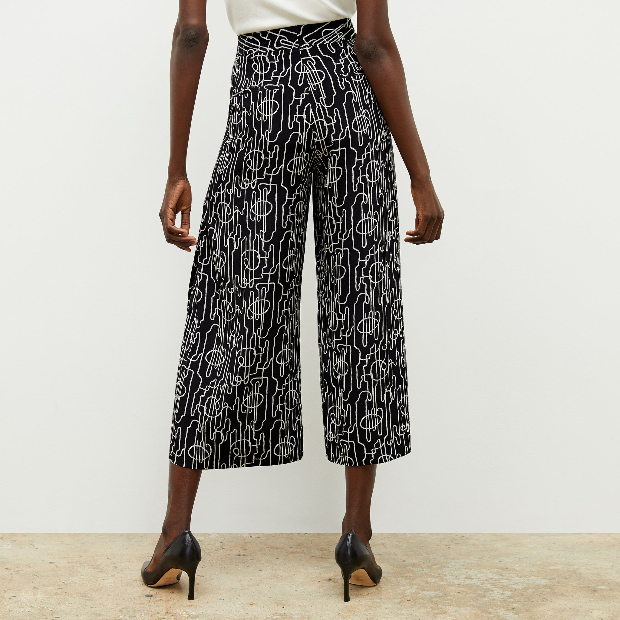 back image of a woman wearing the zhou culotte in symphony print