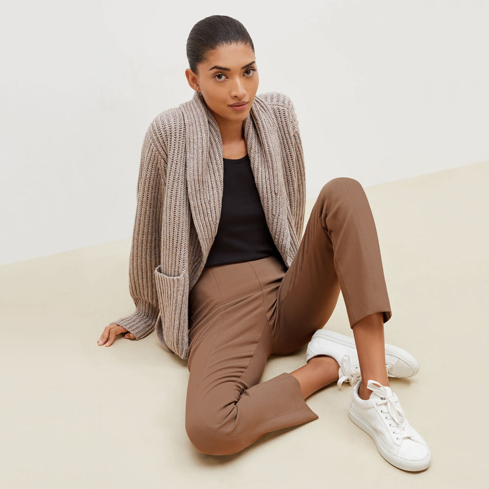 Front image of a woman sitting wearing the Foster Pant—Everstretch in Saddle