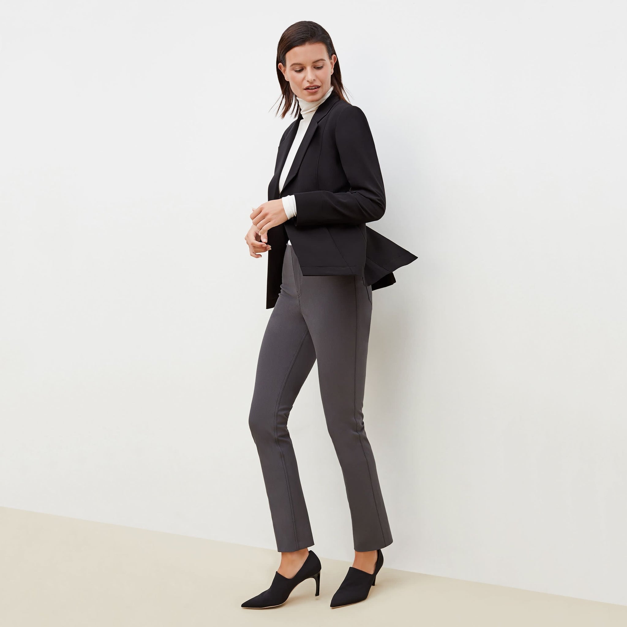 Side image of a woman standing wearing the Hockley Jean—Better Than Denim in Cool Charcoal