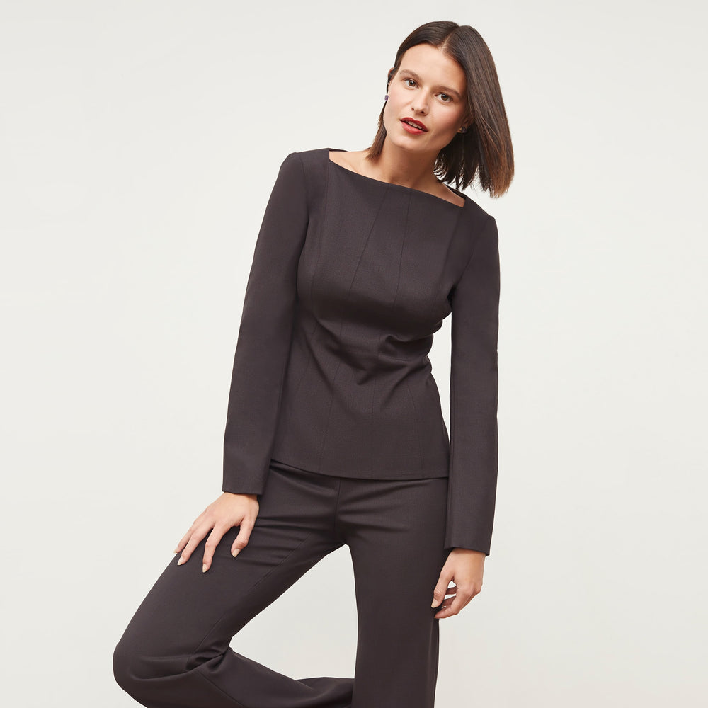 Front image of a woman standing wearing the Rivka Top in Haze