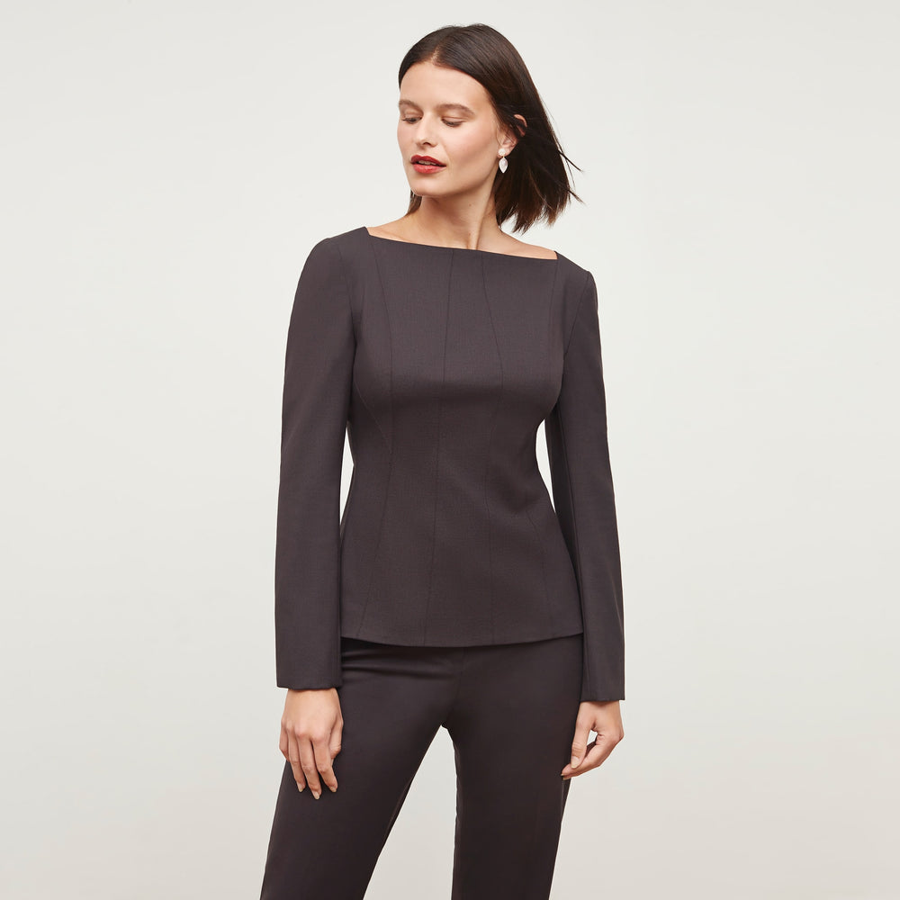 Front image of a woman standing wearing the Rivka Top in Haze