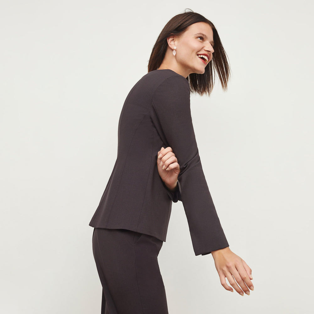 Side image of a woman standing wearing the Rivka Top in Haze
