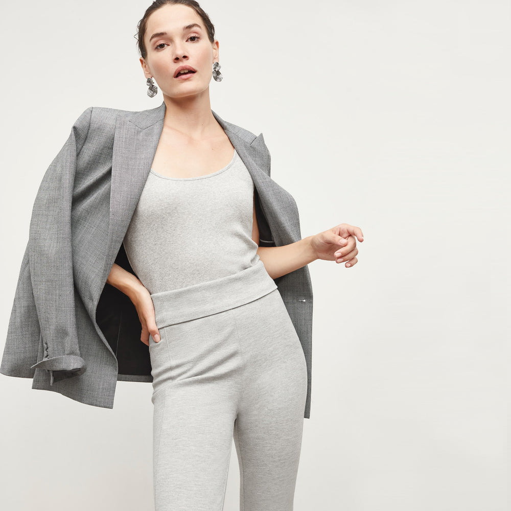Front image of a woman standing wearing the Stella Legging in Gray Melange