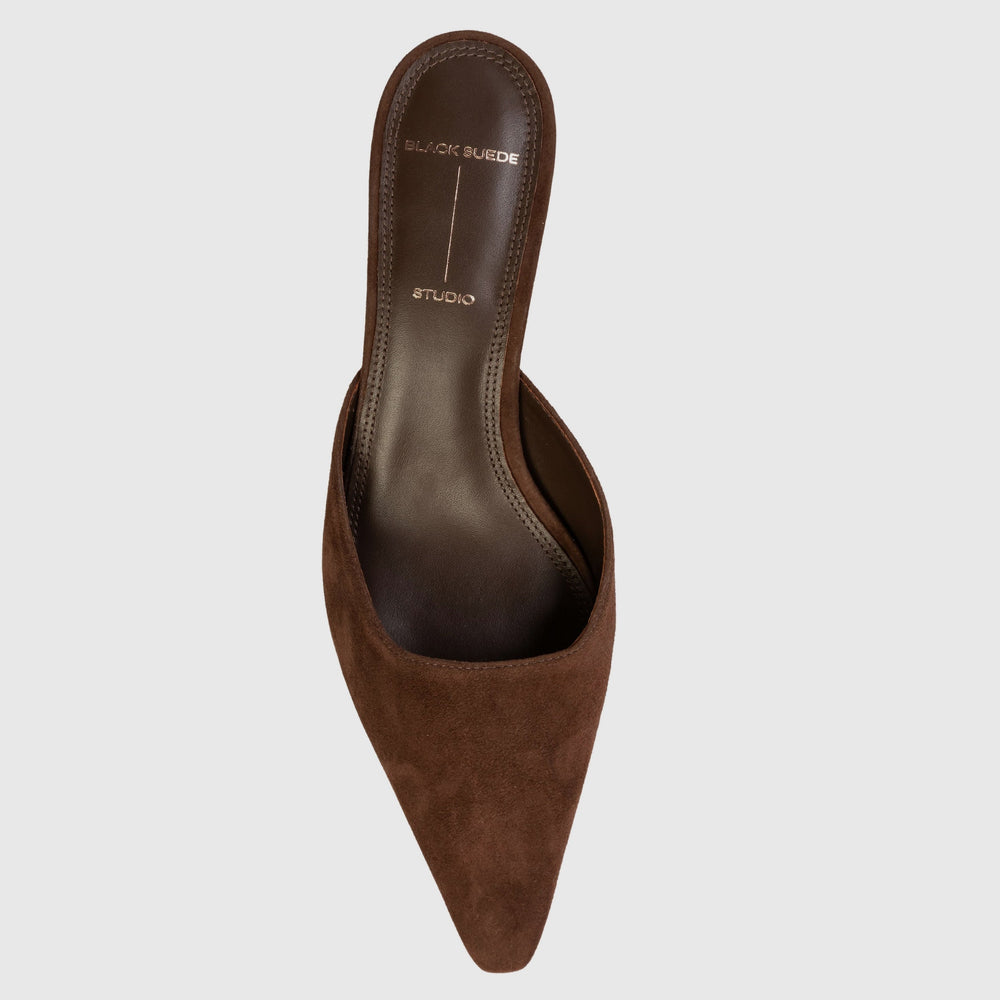 Brown pointed-toe shoe on a light gray background