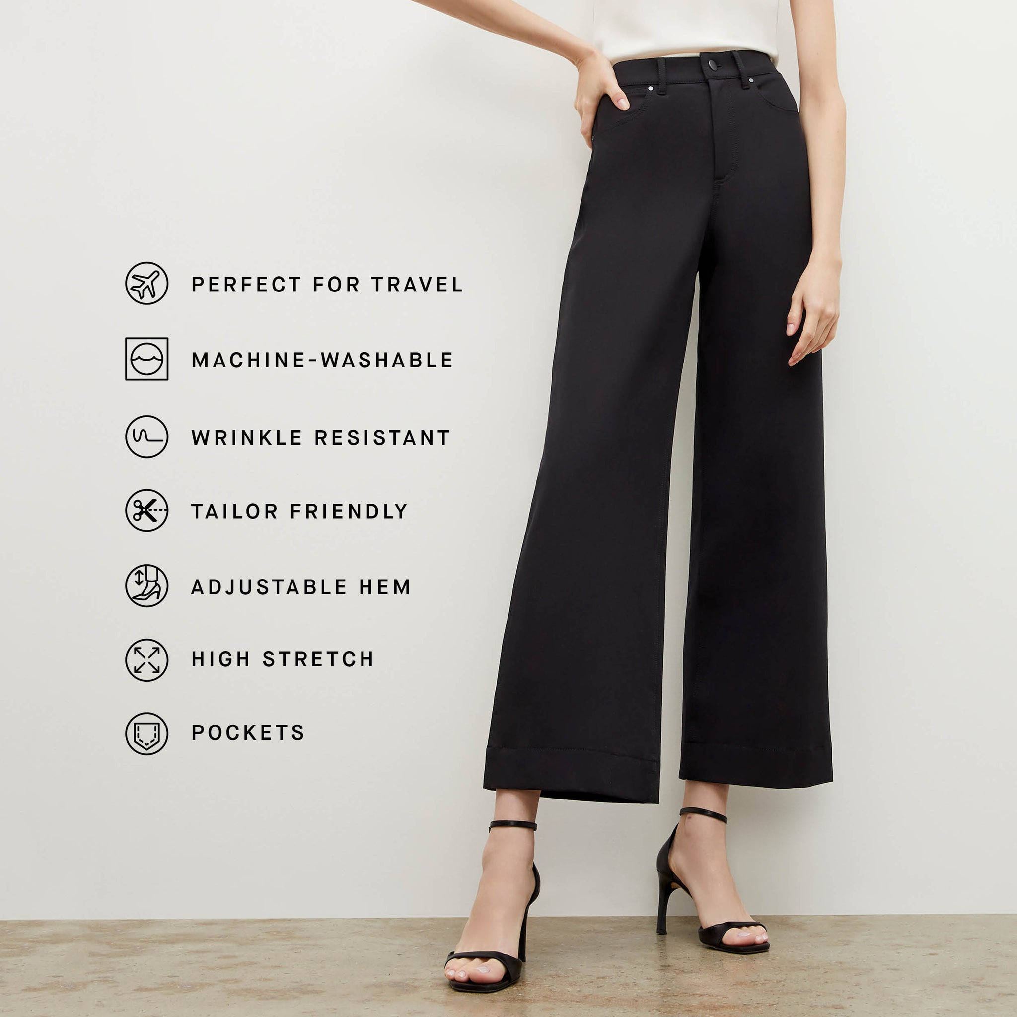 Front image of a woman wearing the Milo Jean in Black with the fabric features listed