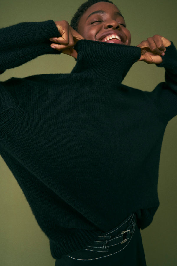 image of a woman wearing a black turtleneck