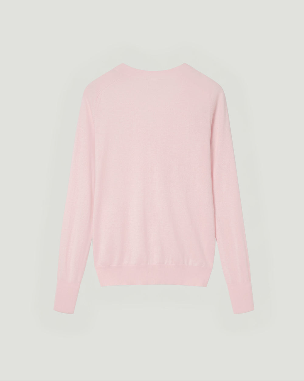 Pink sweater on a light gray background.