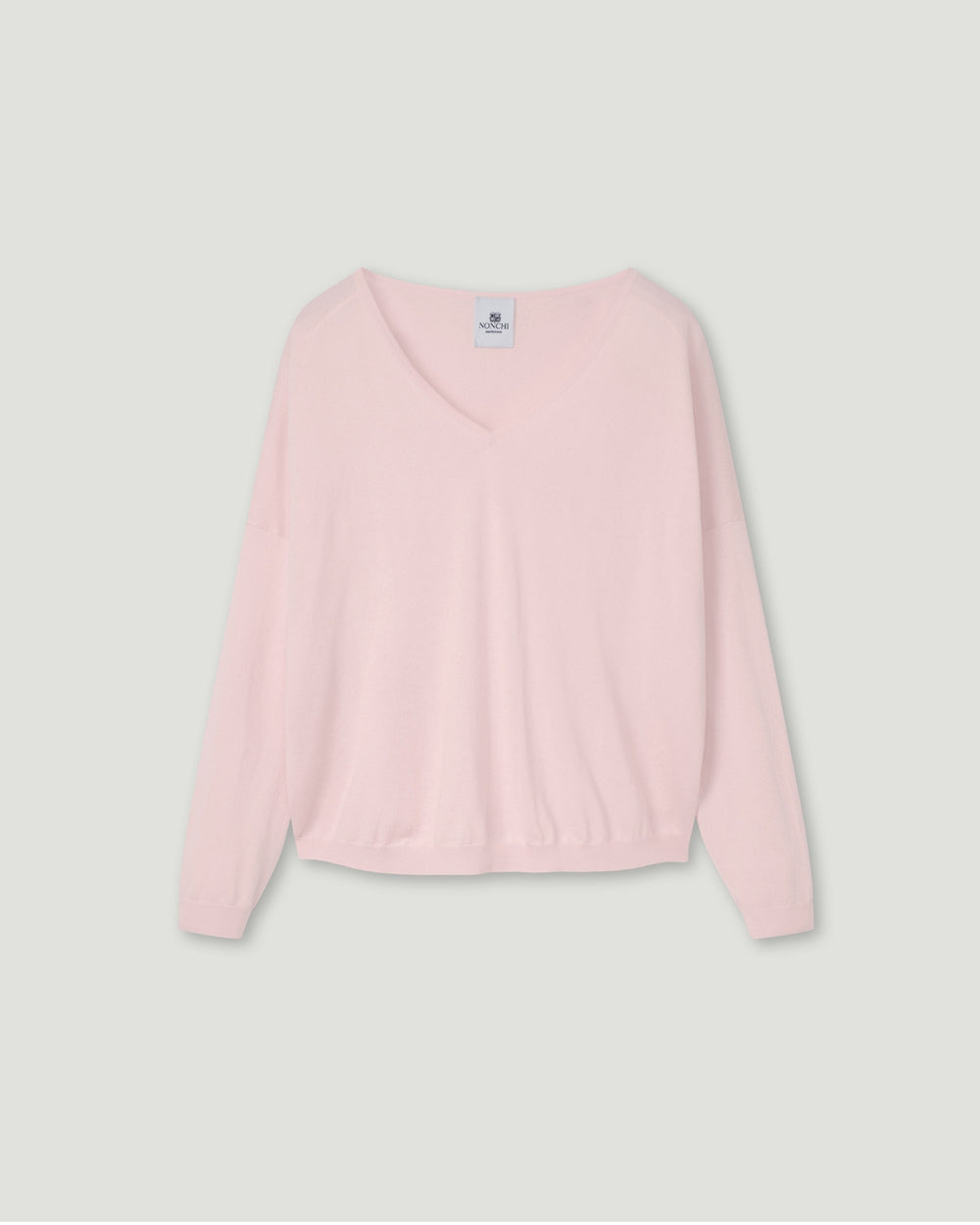 Pink sweater on a light gray background.