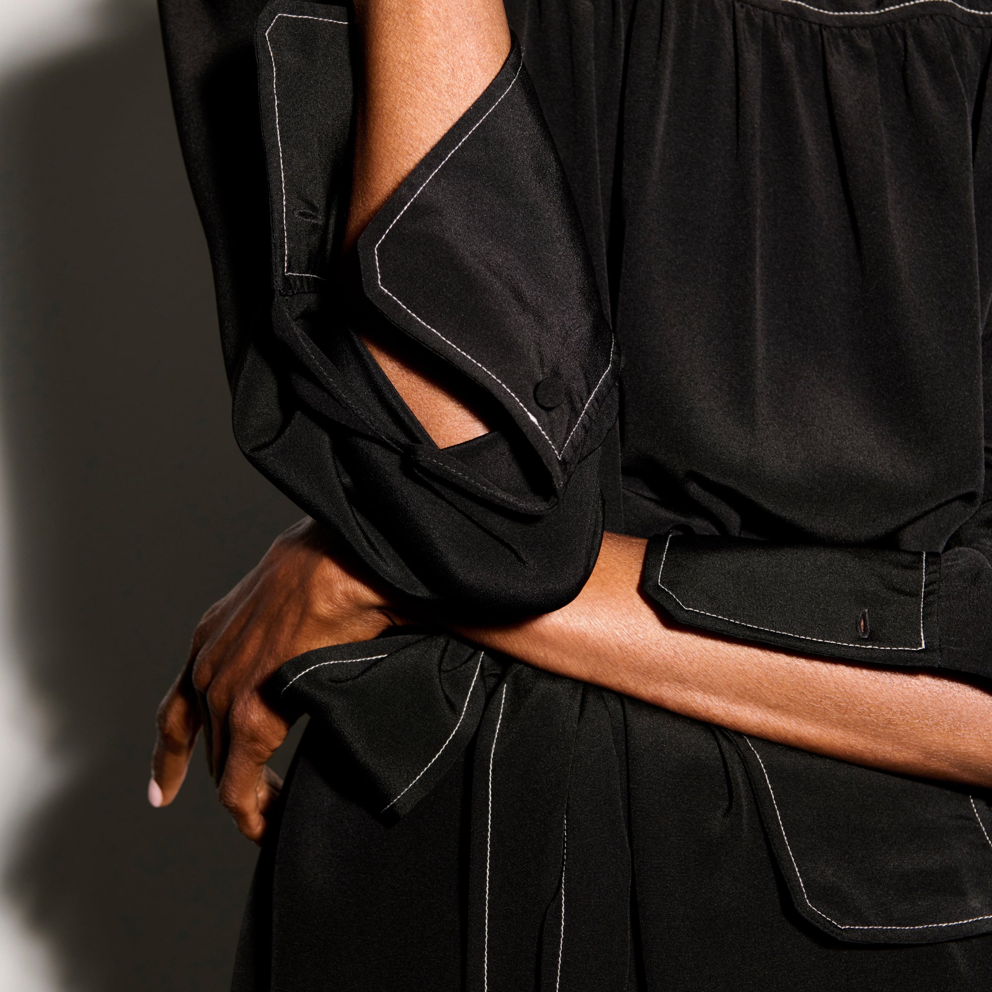 detail image of a woman wearing the edie dress in black