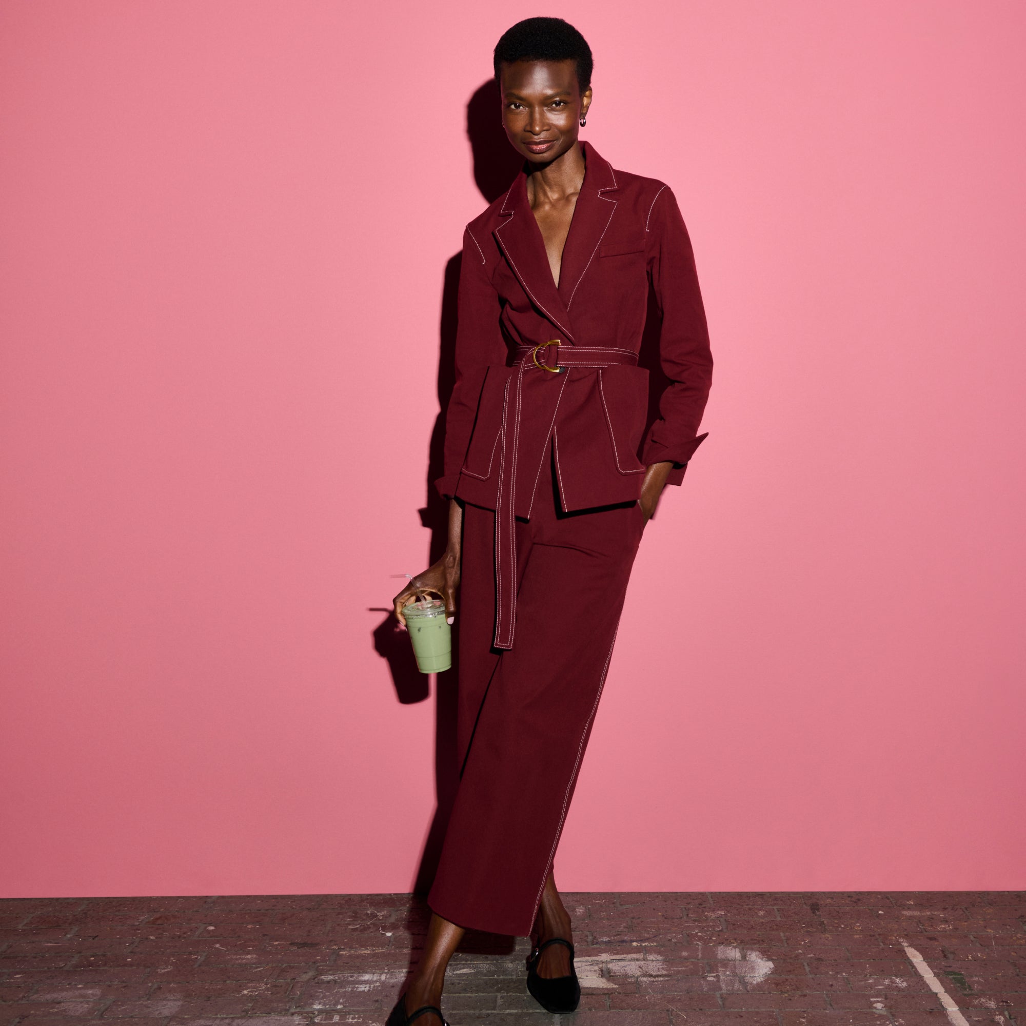 front image of a woman wearing the abby pant and grenville jacket in berry jam 