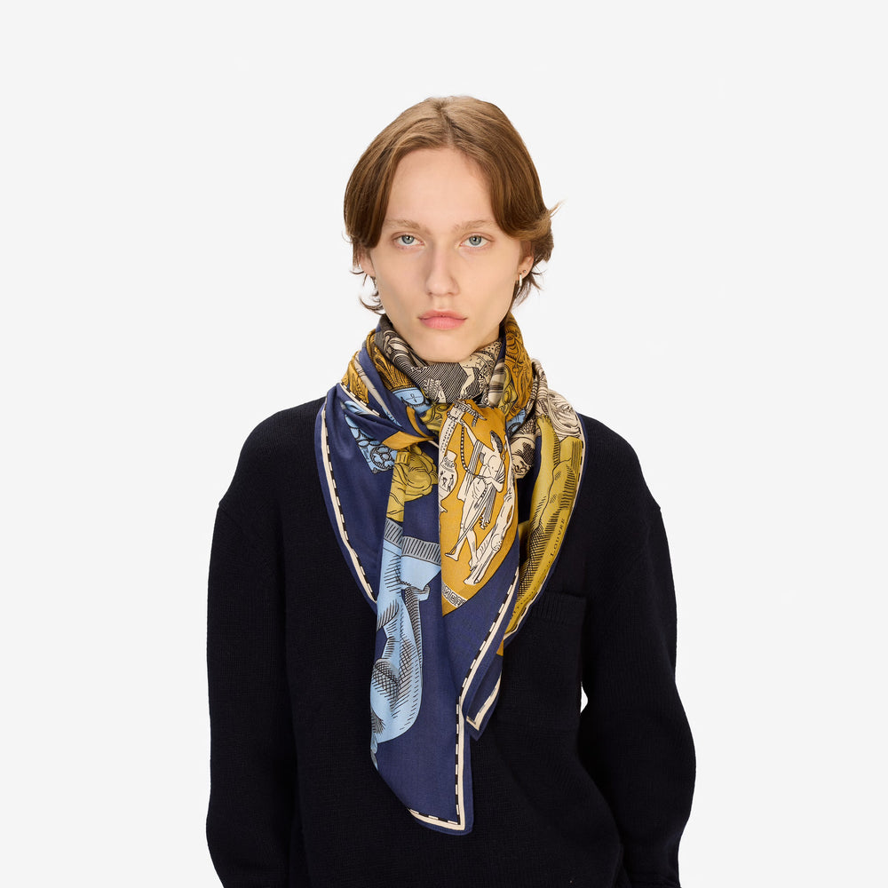 Woman wearing a patterned scarf on a white background