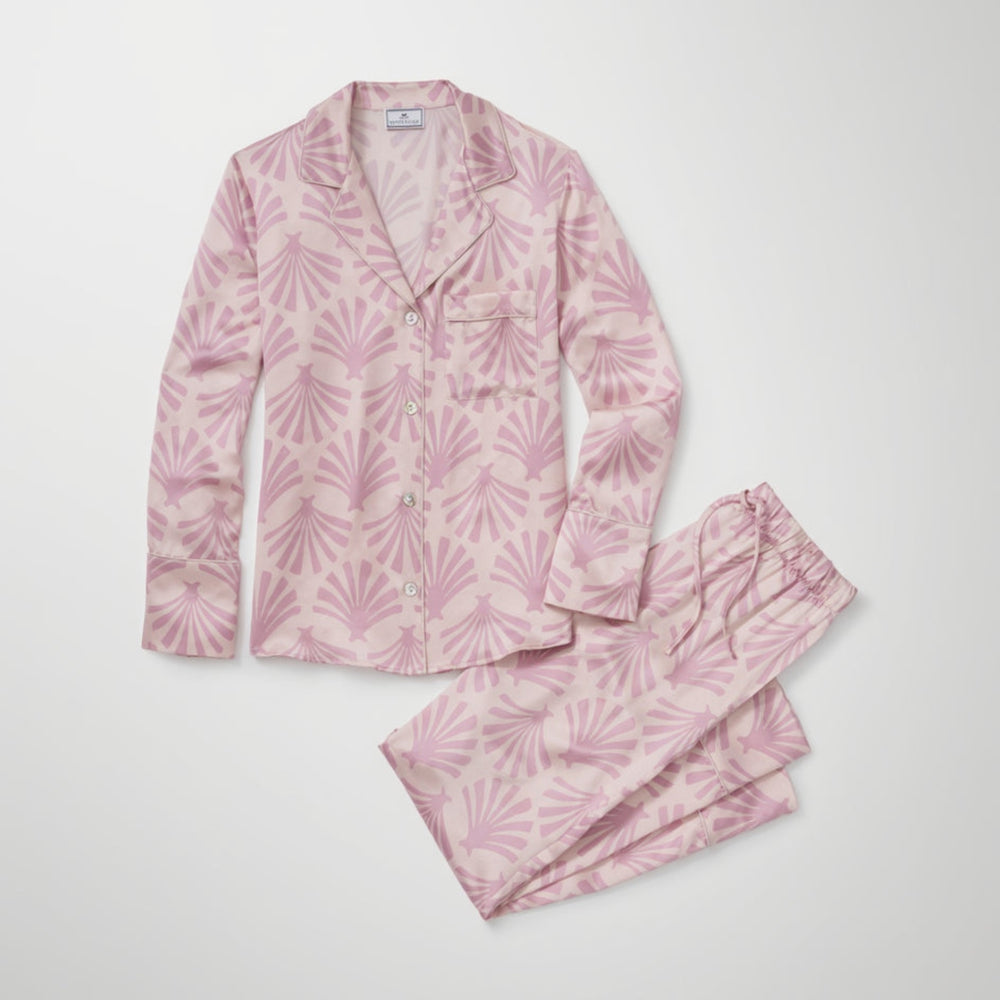 Pink pajama set with leaf pattern on a white background