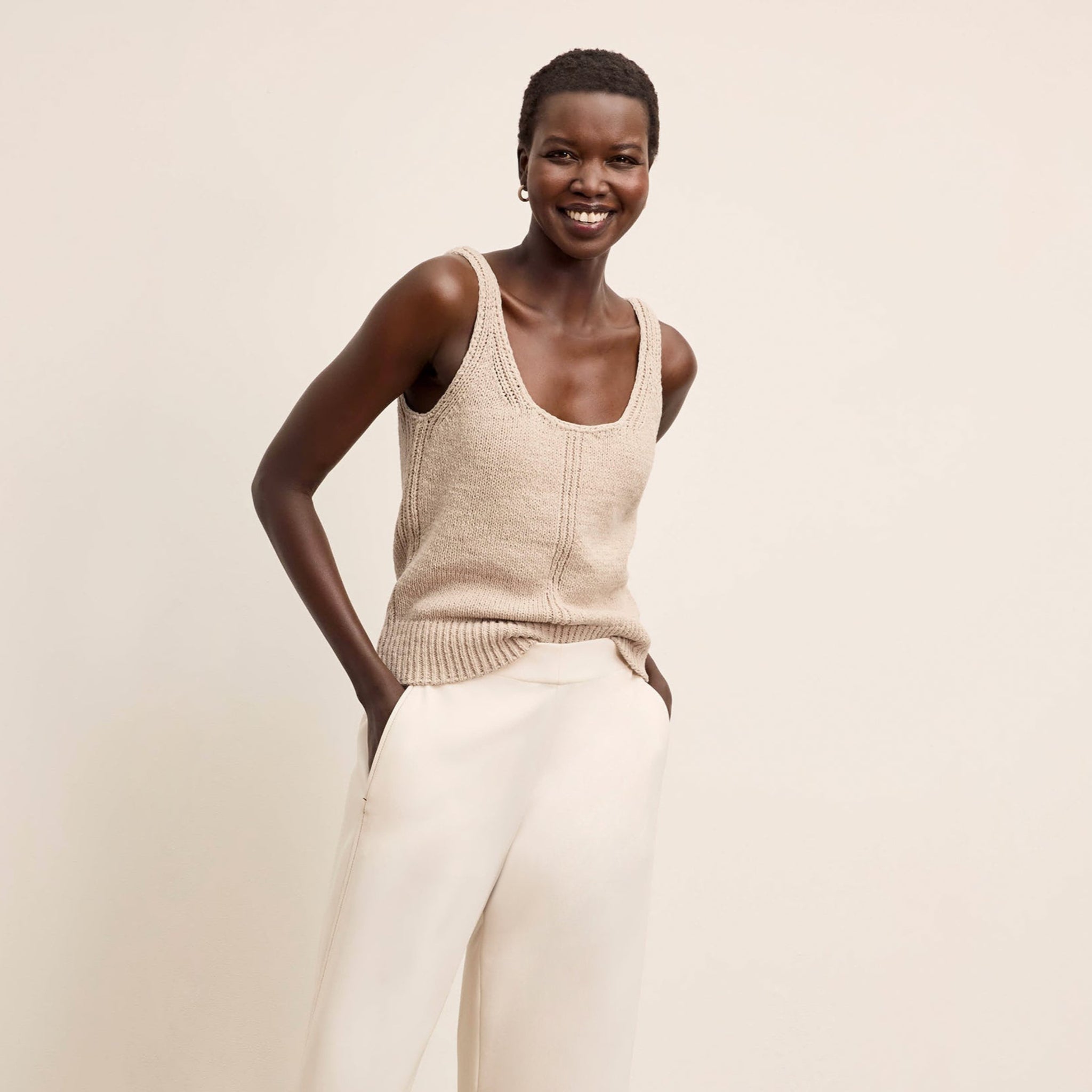 Front image of a woman wearing the Aiko Top in Tan 