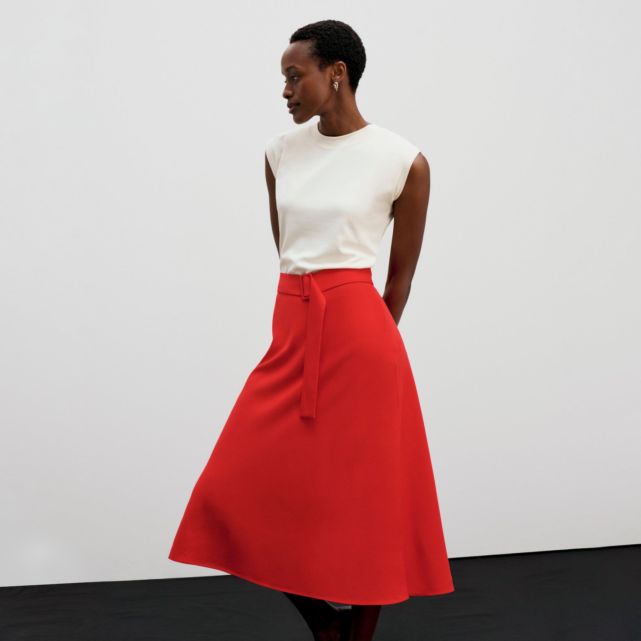 front image of a woman wearing the orchard skirt in maraschinO