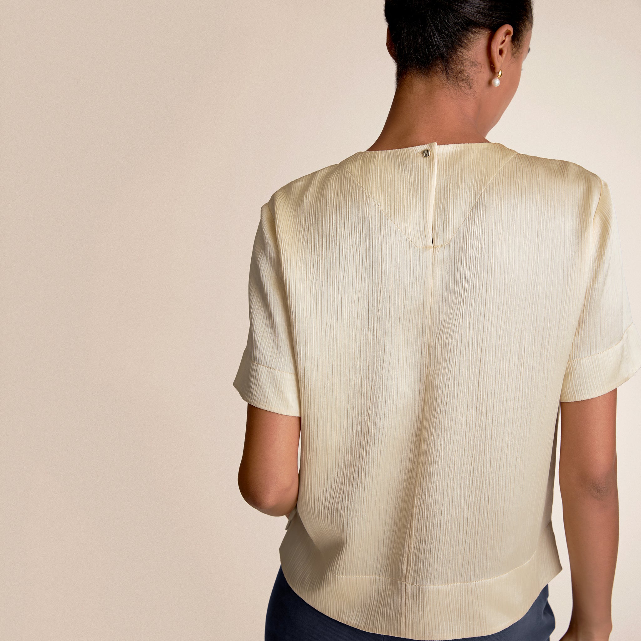 Woman wearing Didion Top in Ivory