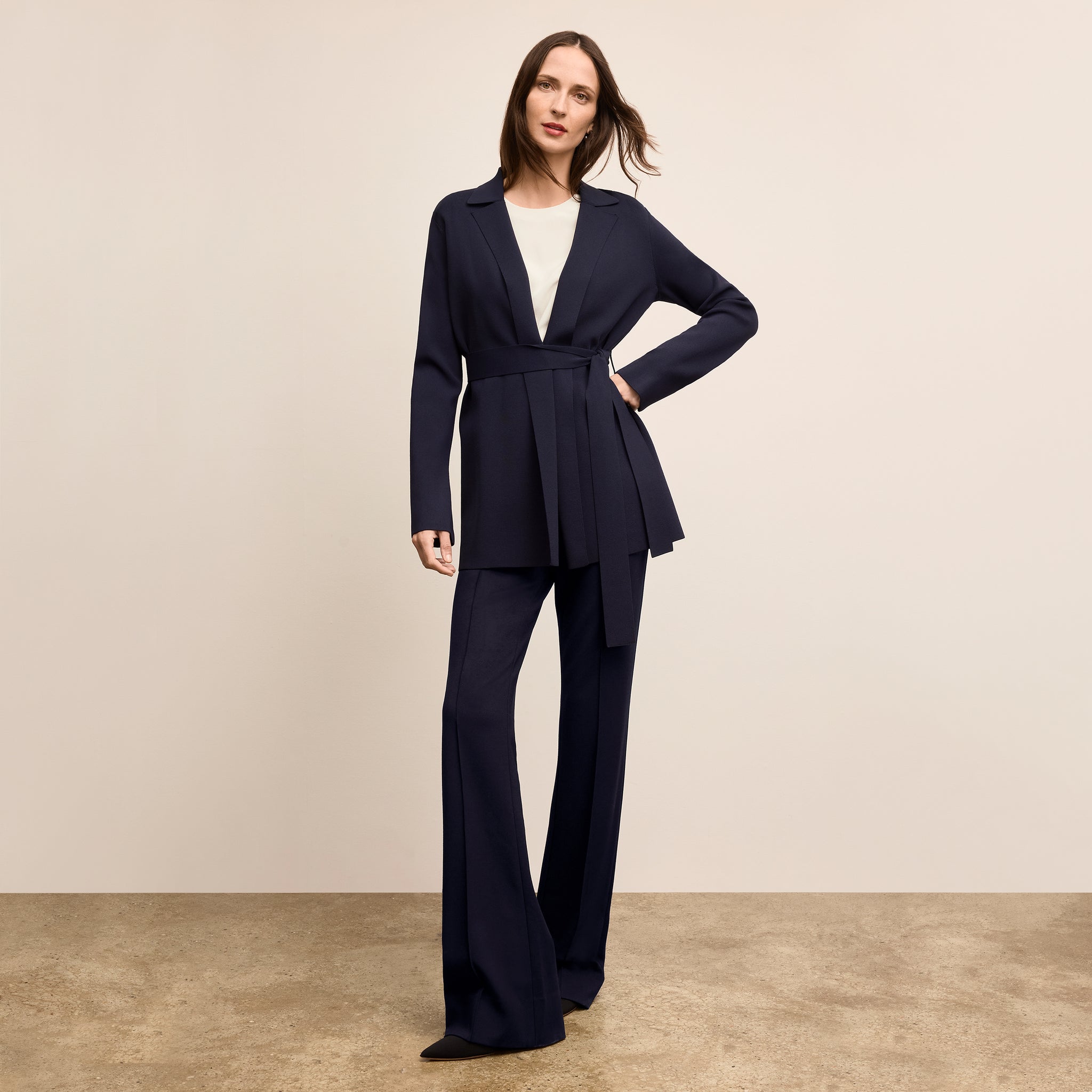 image of a woman wearing the merritt jardigan in navy 