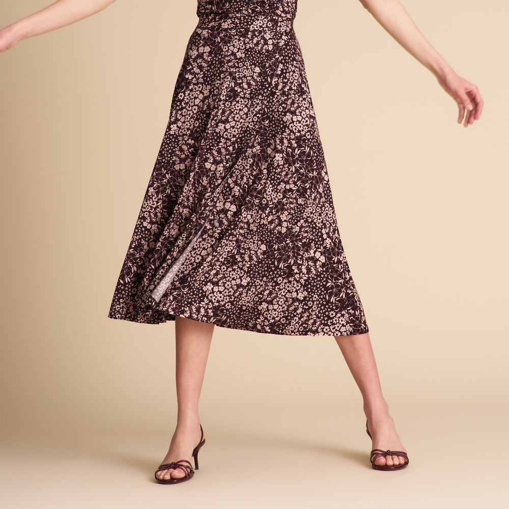Woman wearing a floral dress on a beige background