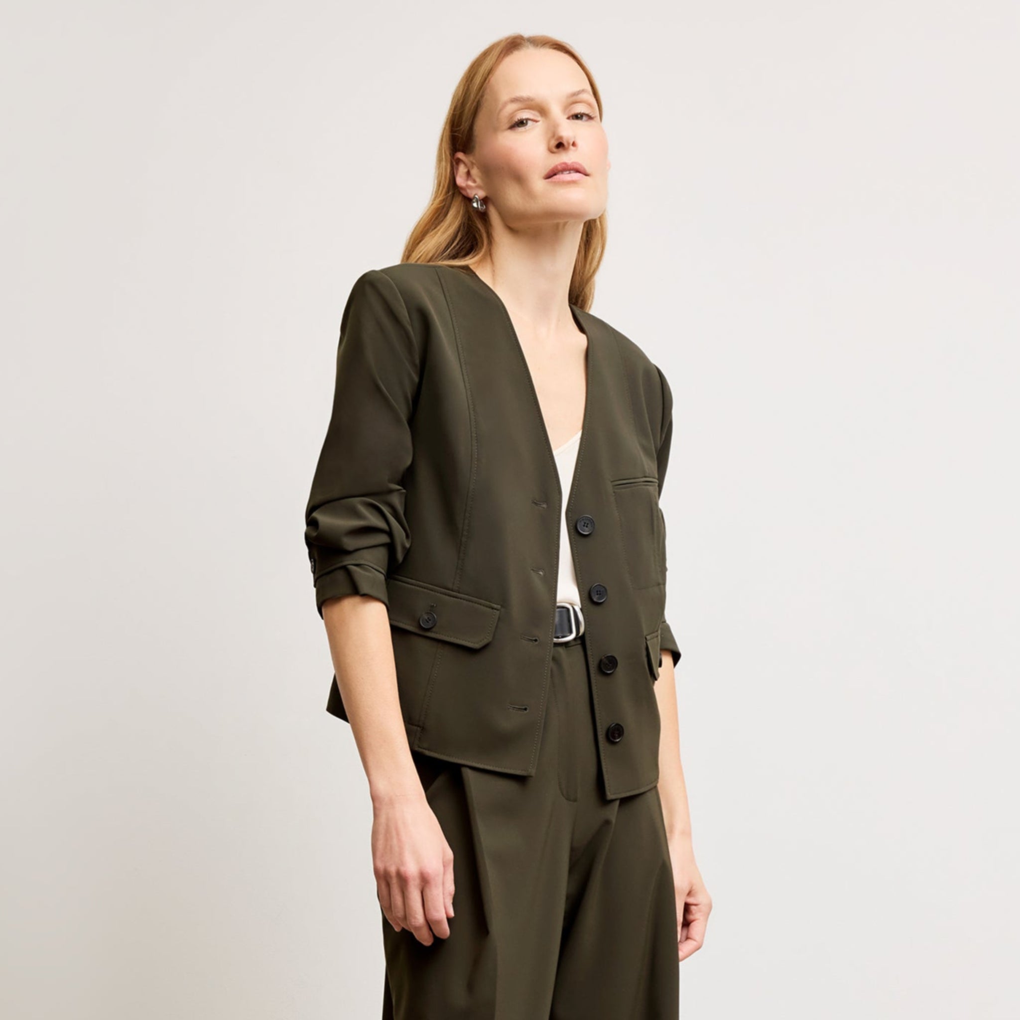 Front image of a woman wearing the Ayla Jacket in Olive 