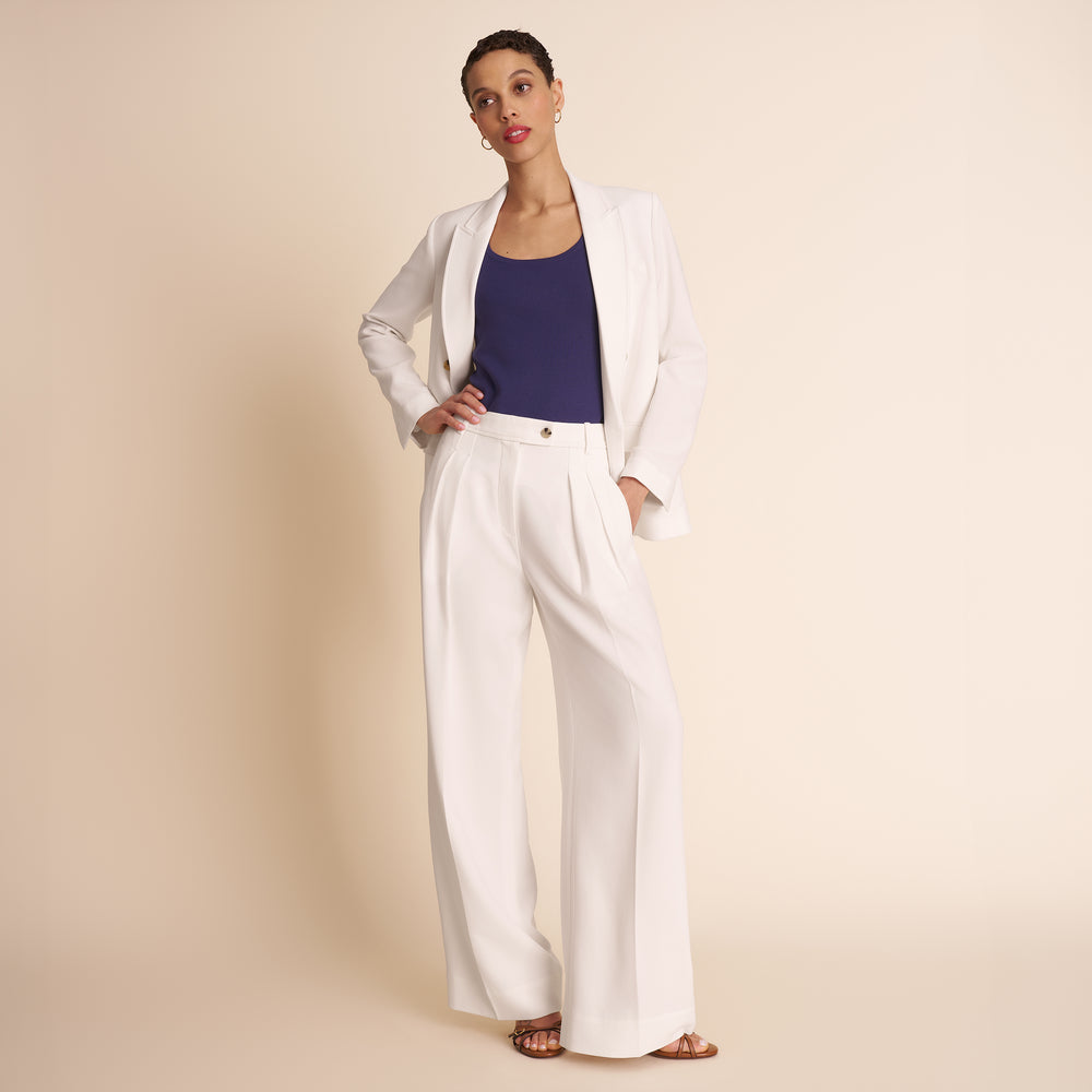 Woman in white blazer.