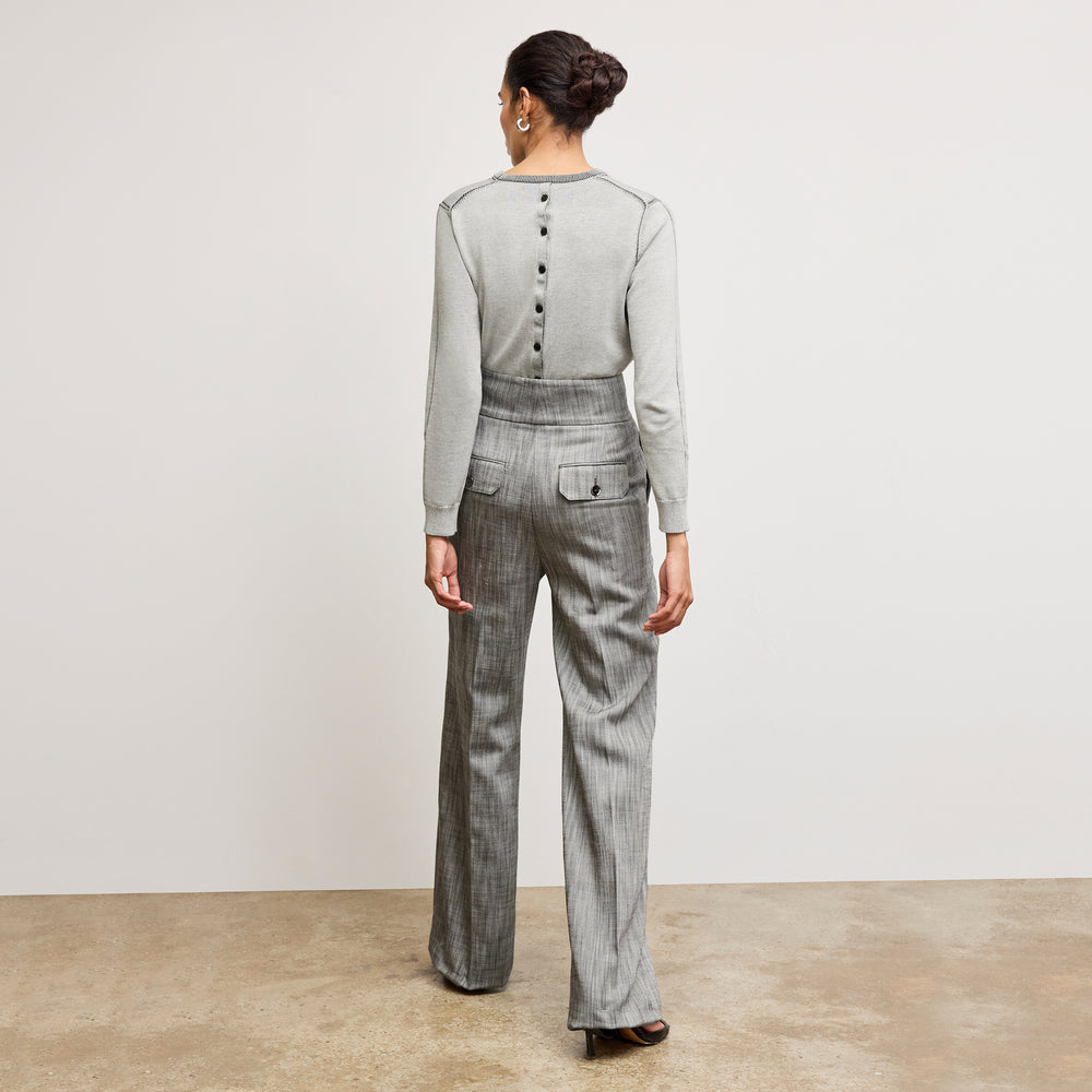 Back image of a woman wearing the larissa sweat in light gray/ivory