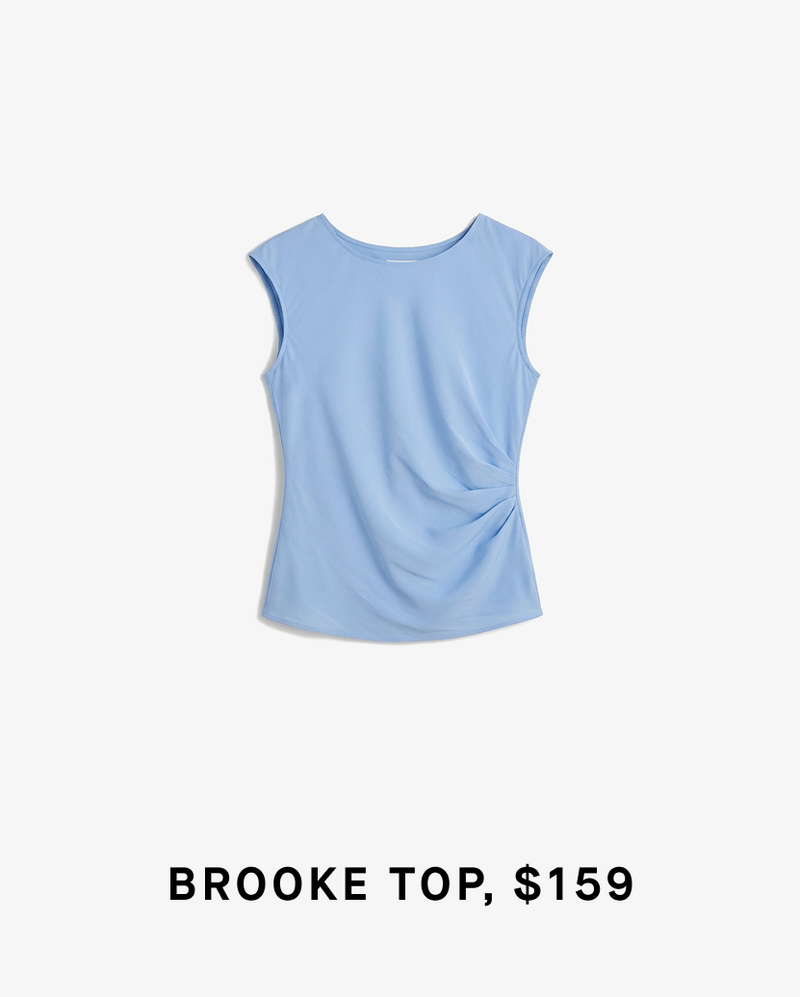 Light blue sleeveless top on a white background with text 'BROOKE TOP, $159'.