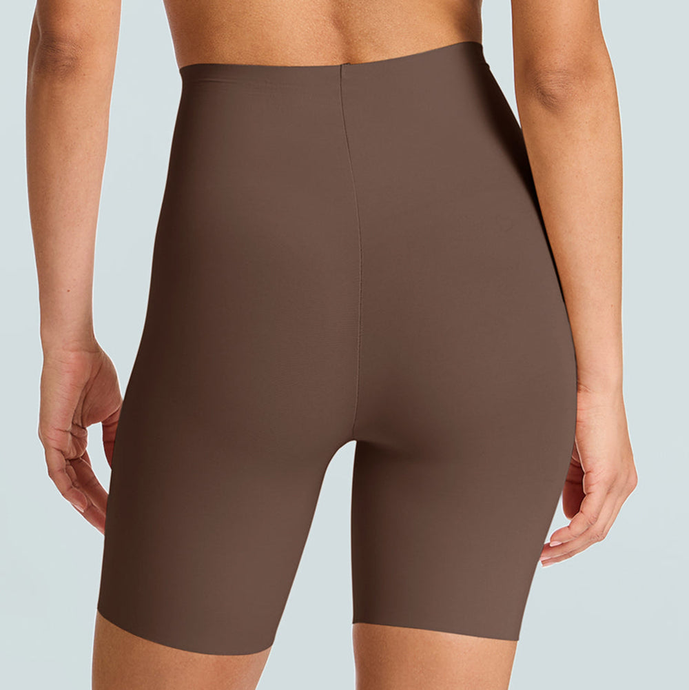Brown high-waisted shorts worn by a person on a light blue background