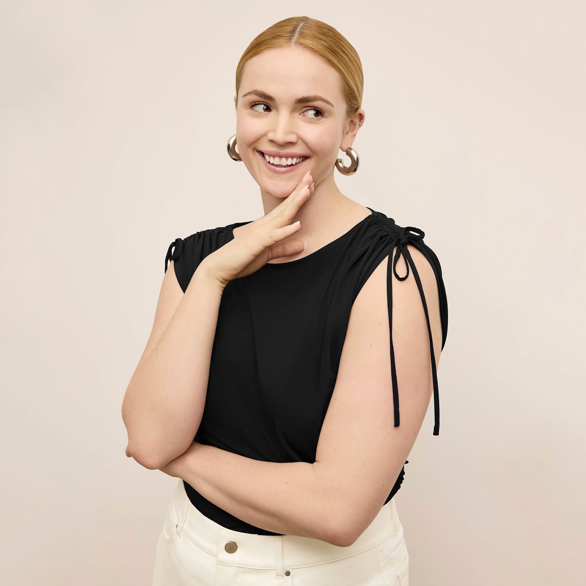Front image of a woman wearing the Dotty Top in Black