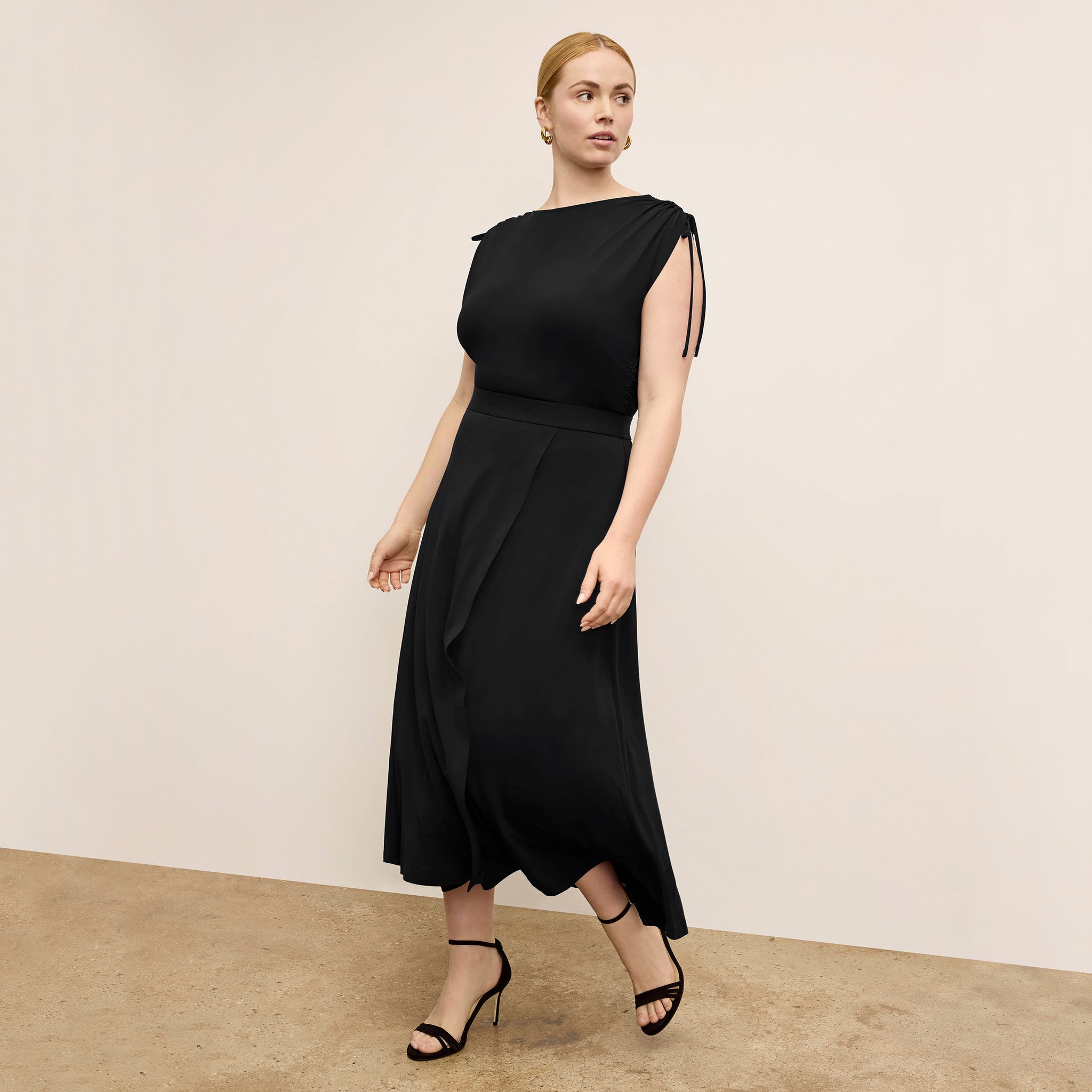 Front image of a woman wearing the Dotty Top in Black