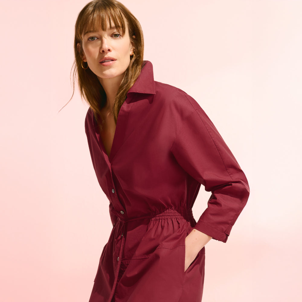front image of a woman wearing the boden dress in cinnabar