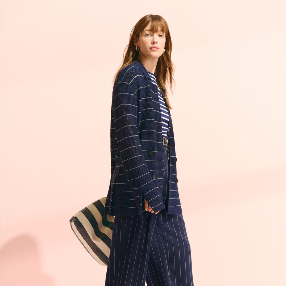 front image of a woman wearing the cody jardigan in dot knit and saint james tee