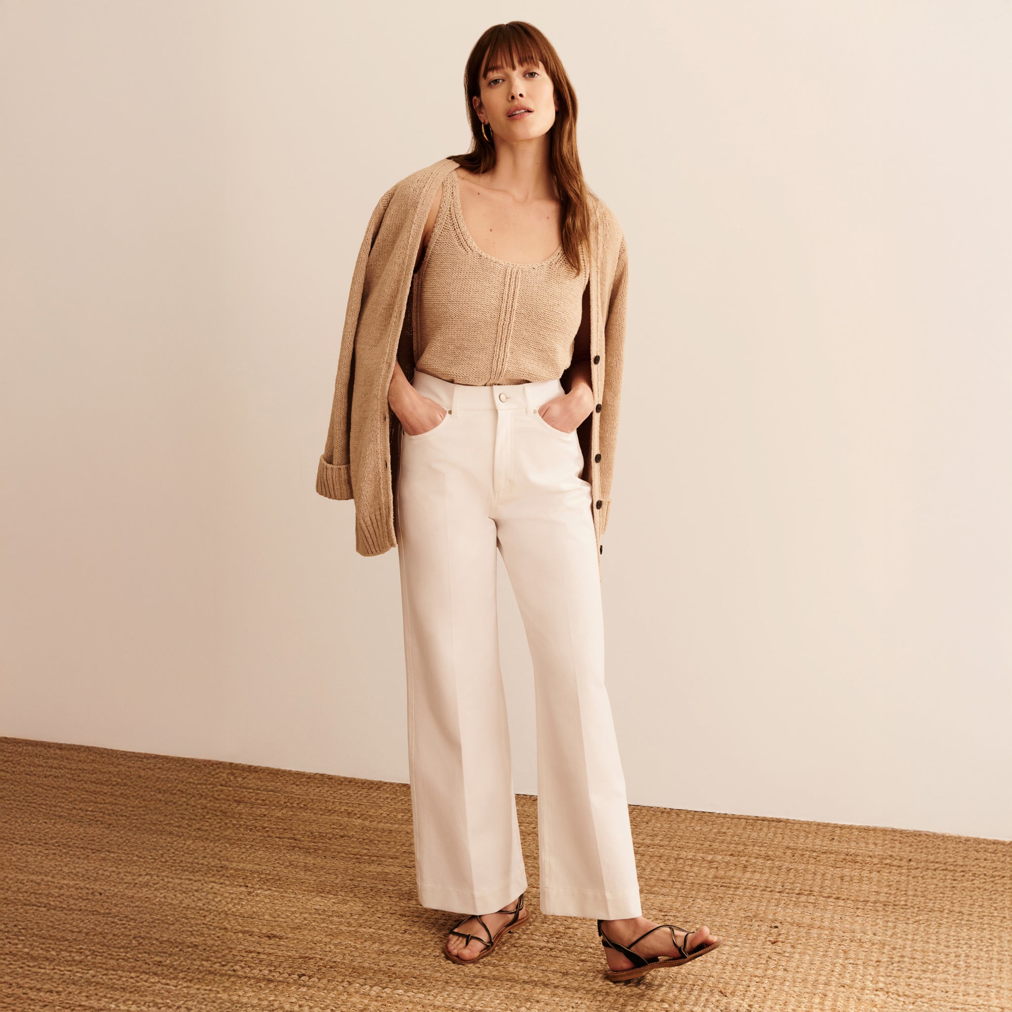 Front image of a woman wearing the Aiko Top in Tan