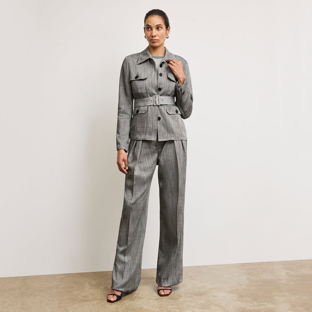 Front image of a woman wearing the emery jacket in Black/White Porto Weave