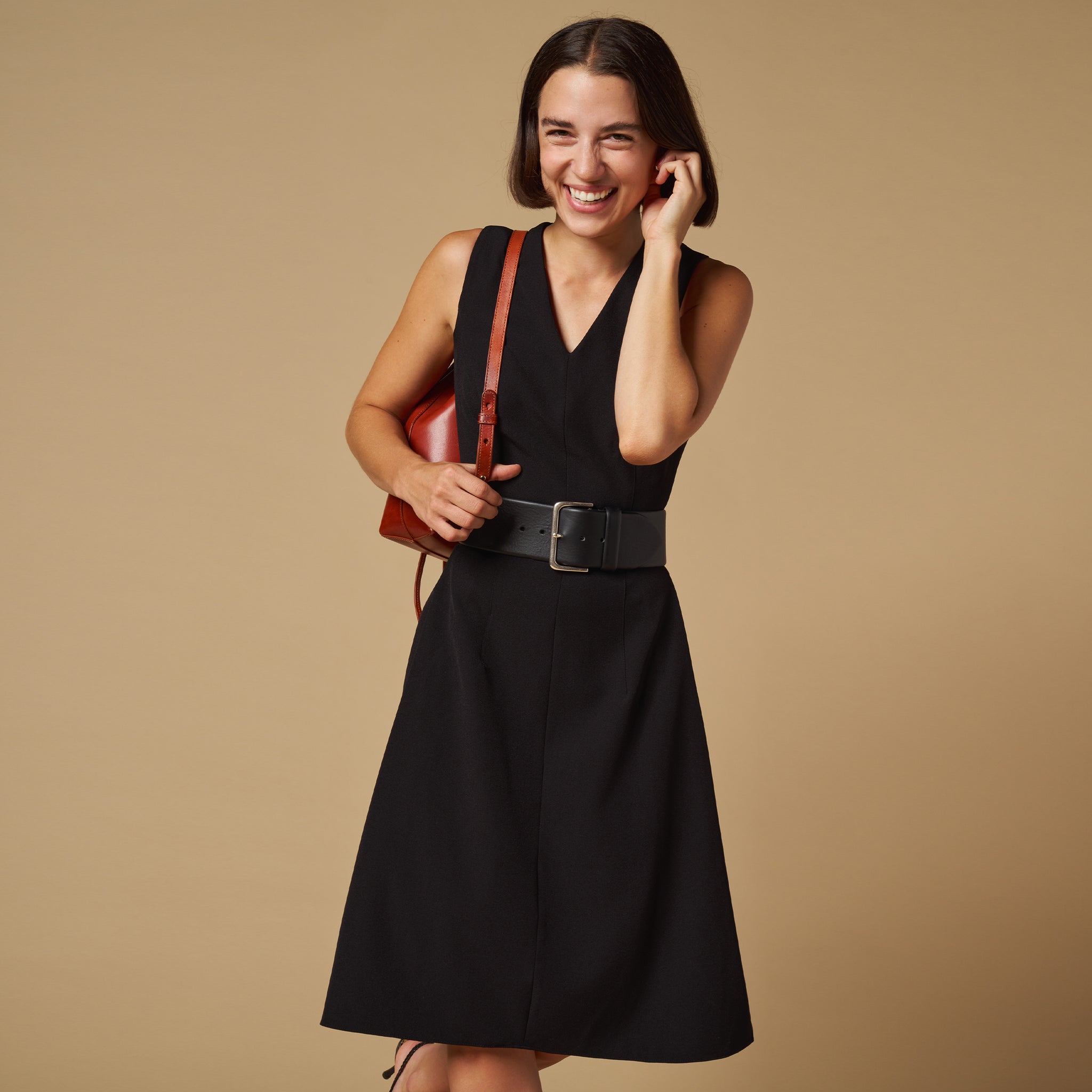 mood image of a woman wearing the jaycie dress in black