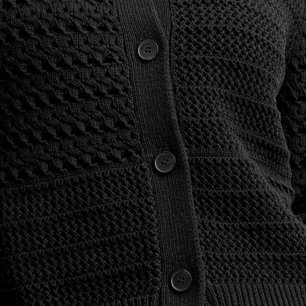 detail image of a woman wearing the zosia cardigan in black
